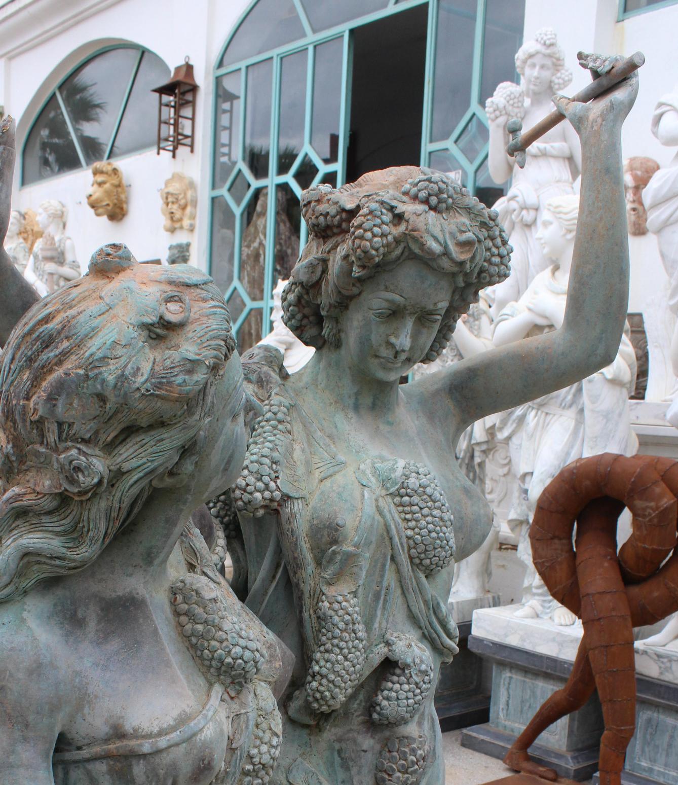 Spagnolo Life-Size Bronze Sculptures of Two Ladies and a Cherub in vendita