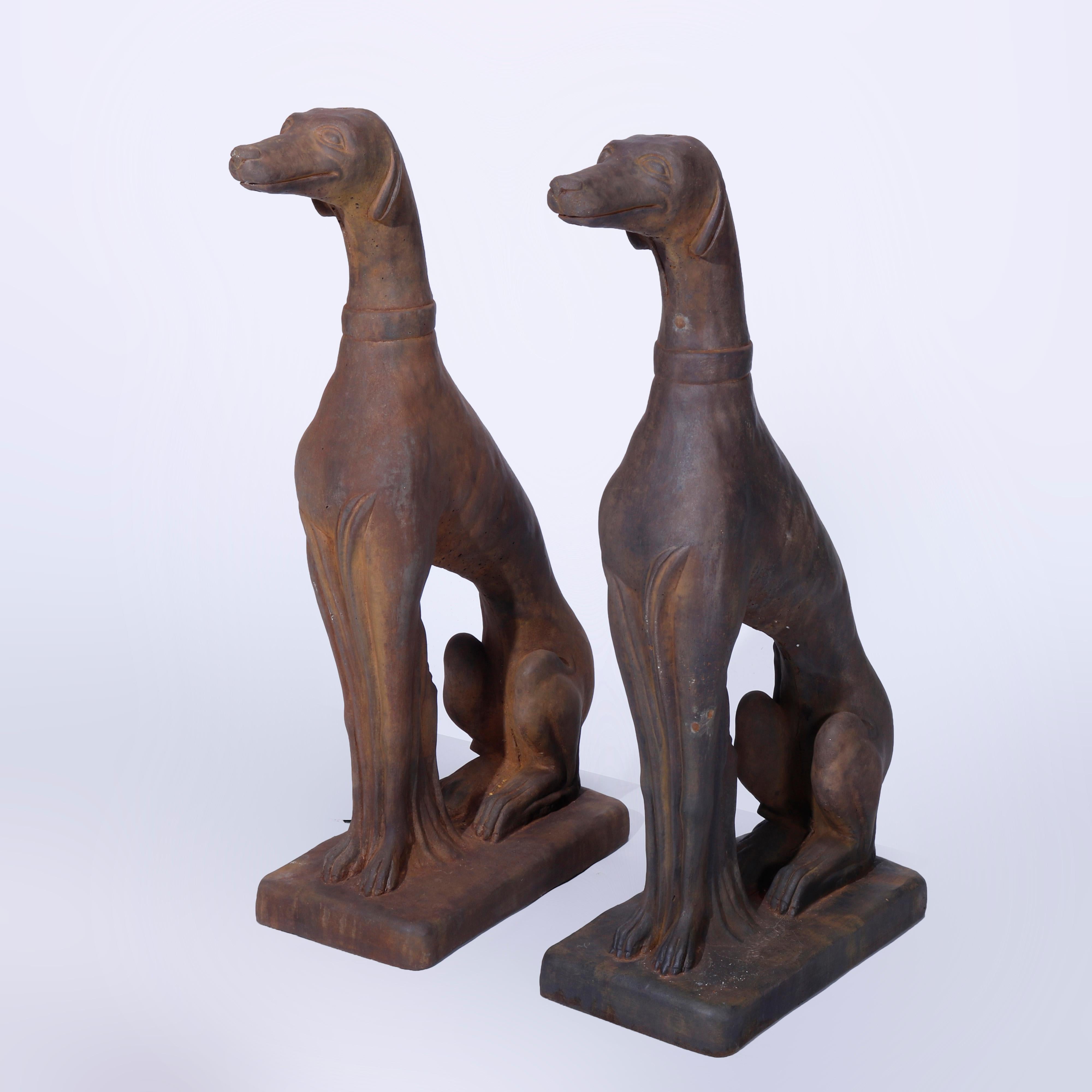 A pair of figural garden sculptures offer bronzed cast hard stone life size Whippets (dogs) in the seated position, 21st century.

Measures - 30'' H x 8'' W x 19''L.
 
Catalogue Note: Ask about DISCOUNTED DELIVERY RATES available to most regions