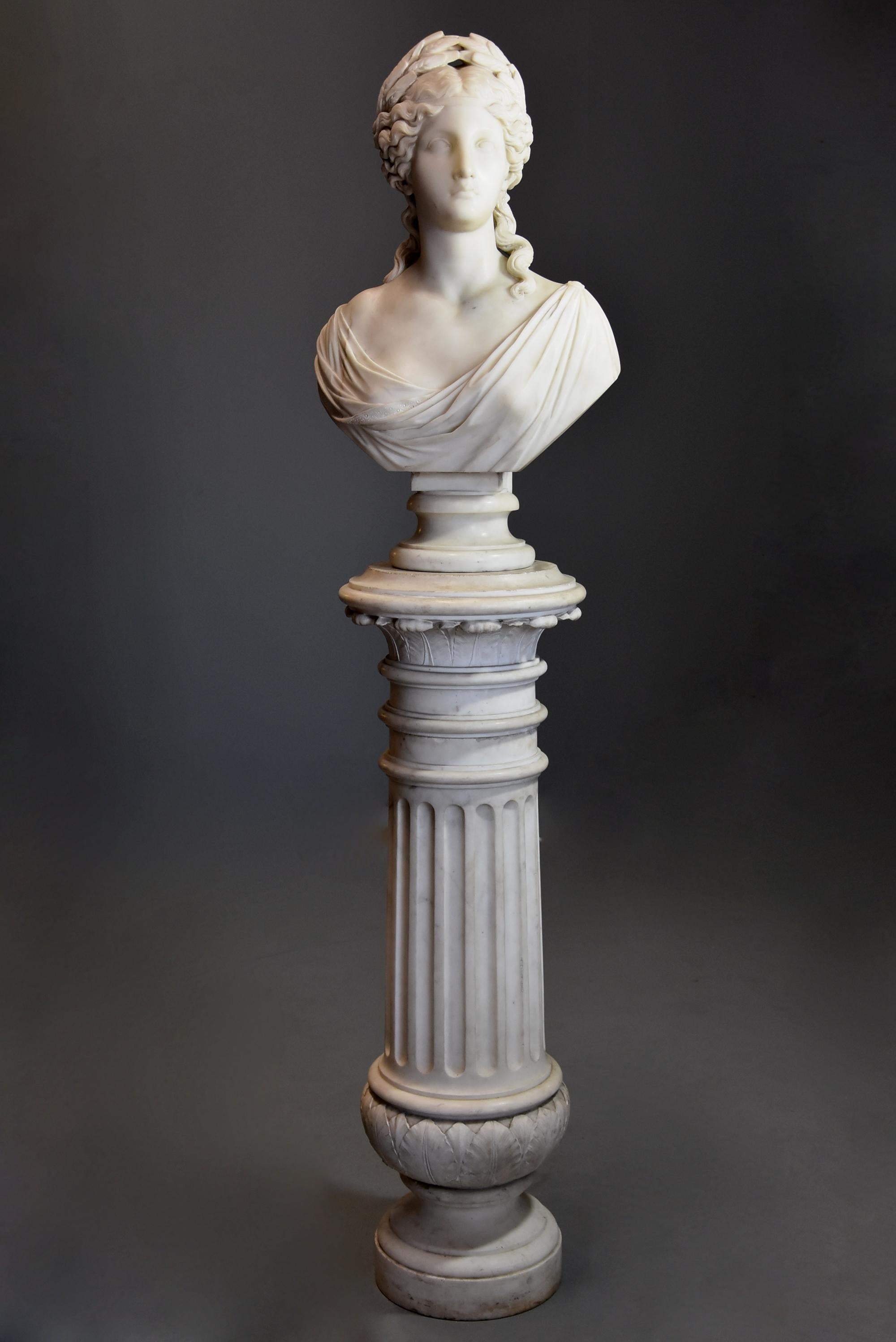 A 19th century life-size finely carved Carrara marble bust of the Roman Goddess, Ceres or her Greek equivalent, Demeter supported on original carved Carrara marble column in the classical style, signed ‘S. KITSON, Fecit 18ROMA74’ (fecit translating