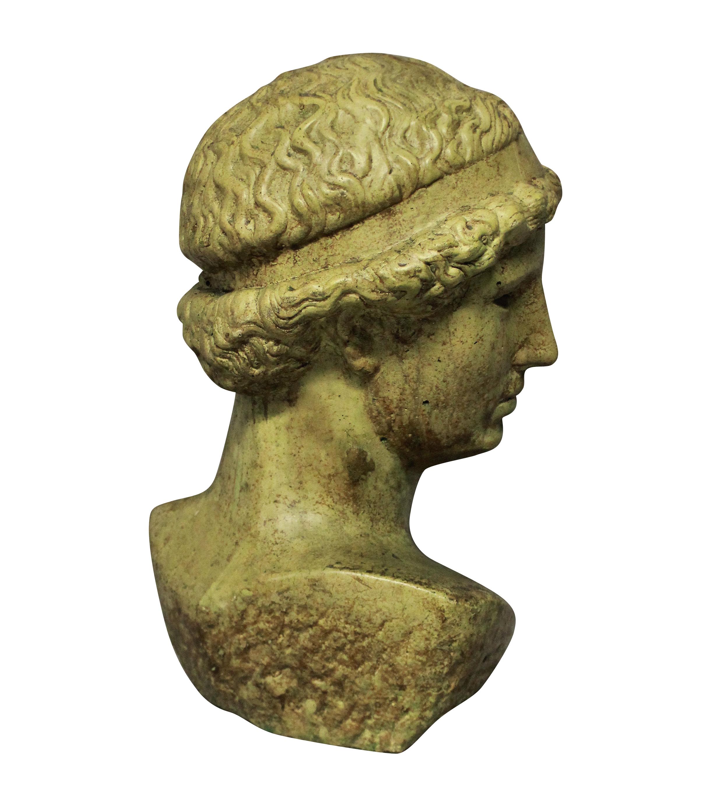 An English life-size, glazed stone head of a Hellenistic youth.