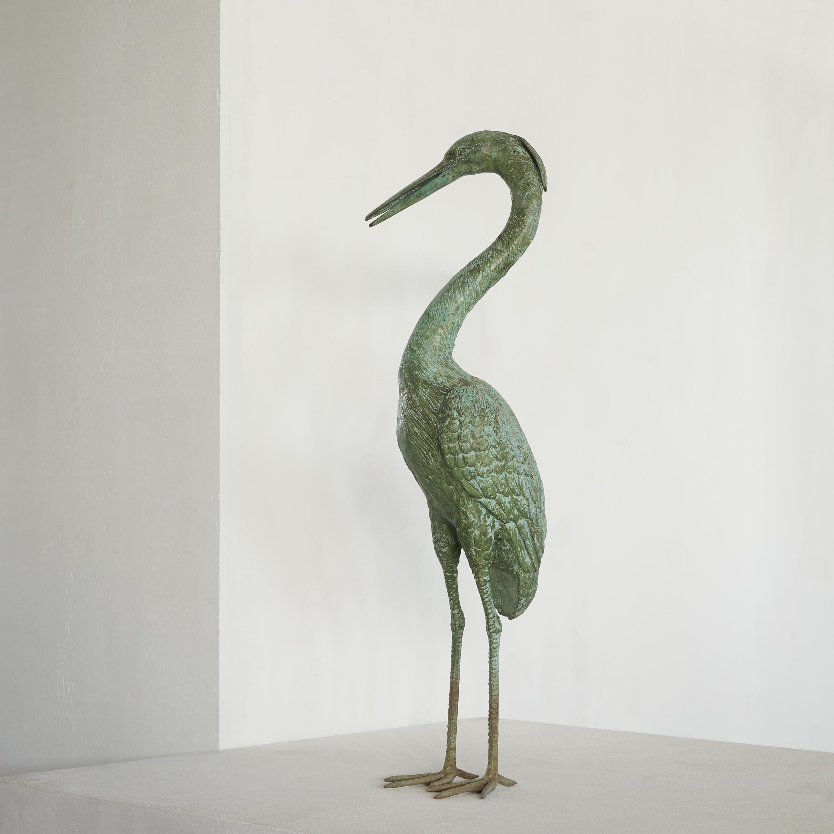 Beautiful and highly detailed life size heron in verdigris patinated brass, mid 20th century. 

This stunning heron is a real eye-catcher in your interior or on your terrace. The great detailing shows that this is not just your average statue of a