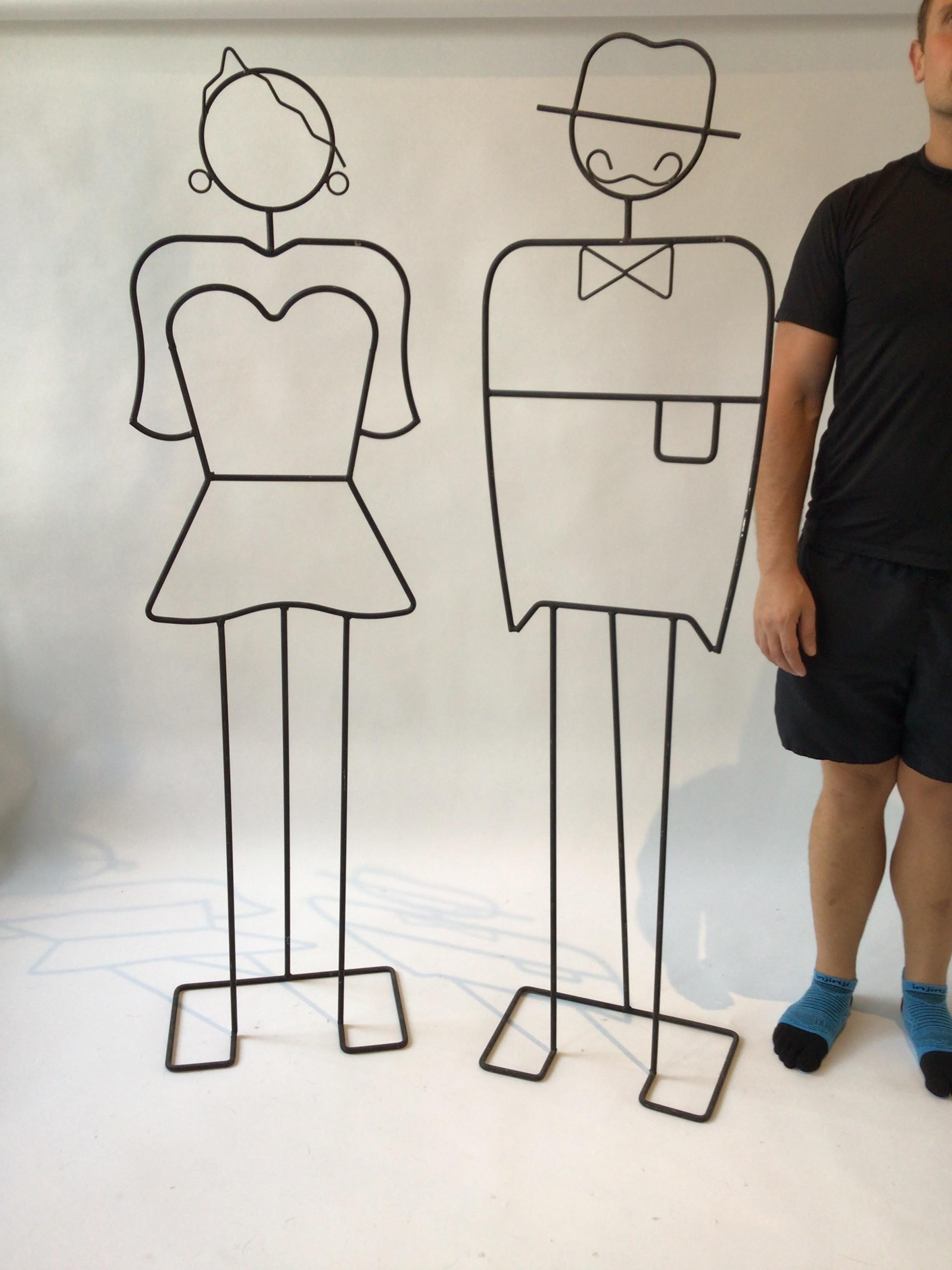 Life size iron sculptures of a man and lady. These sculptures are sold separately. They are priced 1400.00 each.
