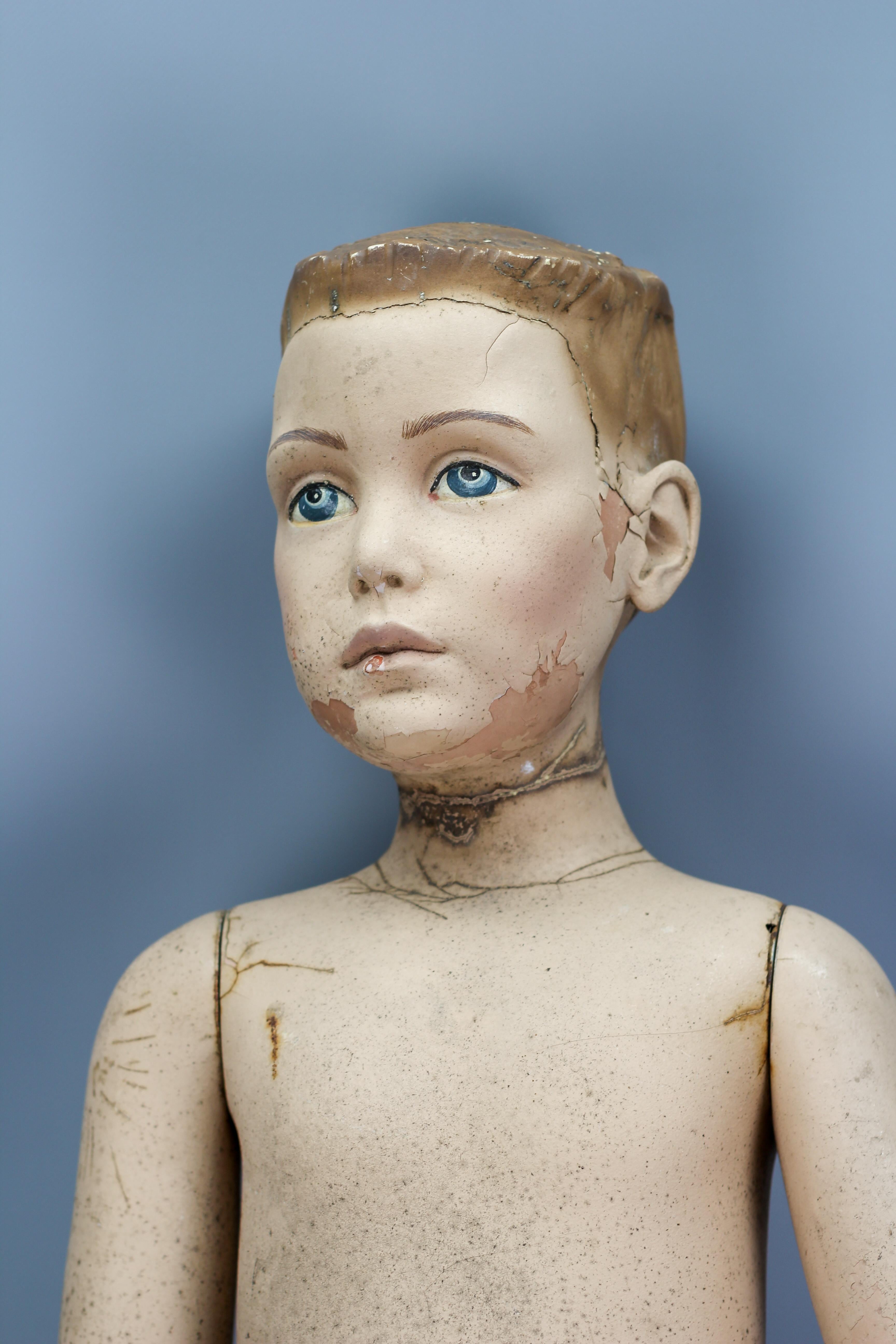 Life-size mannequin boy with blue eyes, circa the early 1980s, England, by Adel Rootstein.
An expressive life-size boy mannequin with beautifully hand-painted life-like blue eyes with an expressive look. Marked AJ8.
In good structural condition with