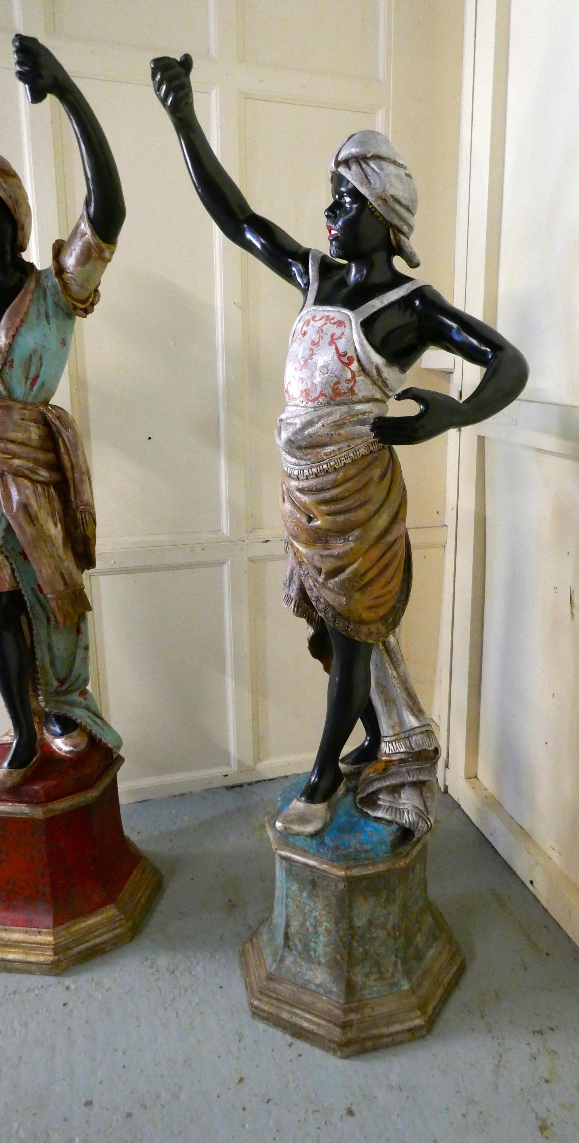 Life size Pair of 19th Century Italian Carved Wooden Statues 

These charming early 19th century Statues stand almost 6ft high, they each have a socket in their hand which once would have held a candle sconce.
They are a male and female pair, him