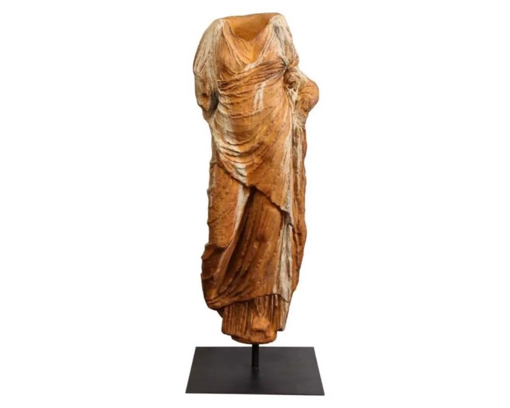 A modern life-size Roman style fiberglass torso, after the antique, mounted on a metal post and stand, circa 1960.

Made of rusted-color patinated fiberglass.

Extremely decorative life-size sculpture that would look amazing in any room.

Measures: