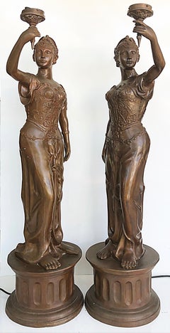 Life Size Spelter Torchère Light Statues on Plinths with Patina, Pair