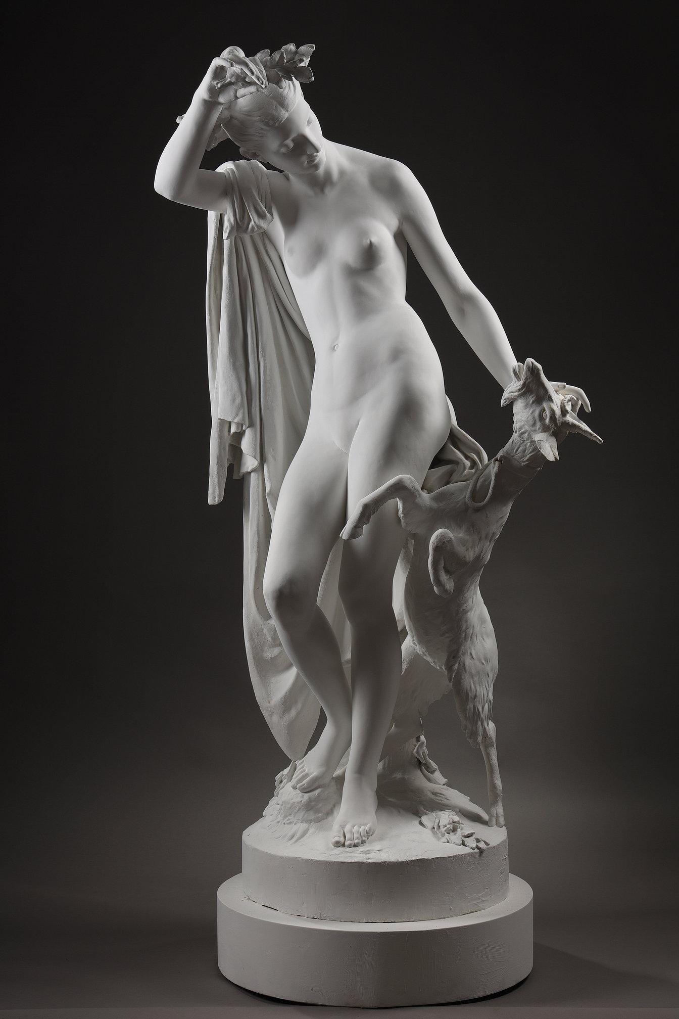 An incredible plaster sculpture of the Nymph Amalthée and Zeus's goat. Amalthée is the goat that nurses Zeus as a child, and which Rhea has entrusted to protect him from the jealousy of Chronos. Later, the Goat metamorphoses into a Nymph. We have