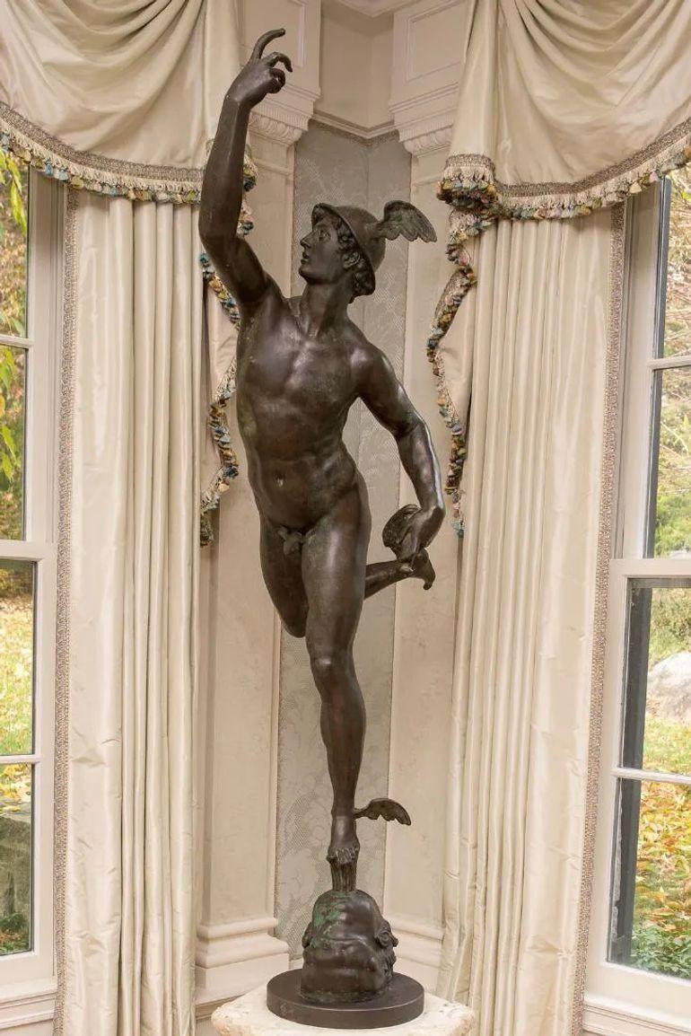 Life-sized Bronze Statue of Hermes, 18th Century, French, After Giambologna
 
Direct, as seen photographed, from a Greenwich CT mansion comes this six foot Important patinated bronze statuary depicting Mercury (or Hermes) in flight on a cherub head