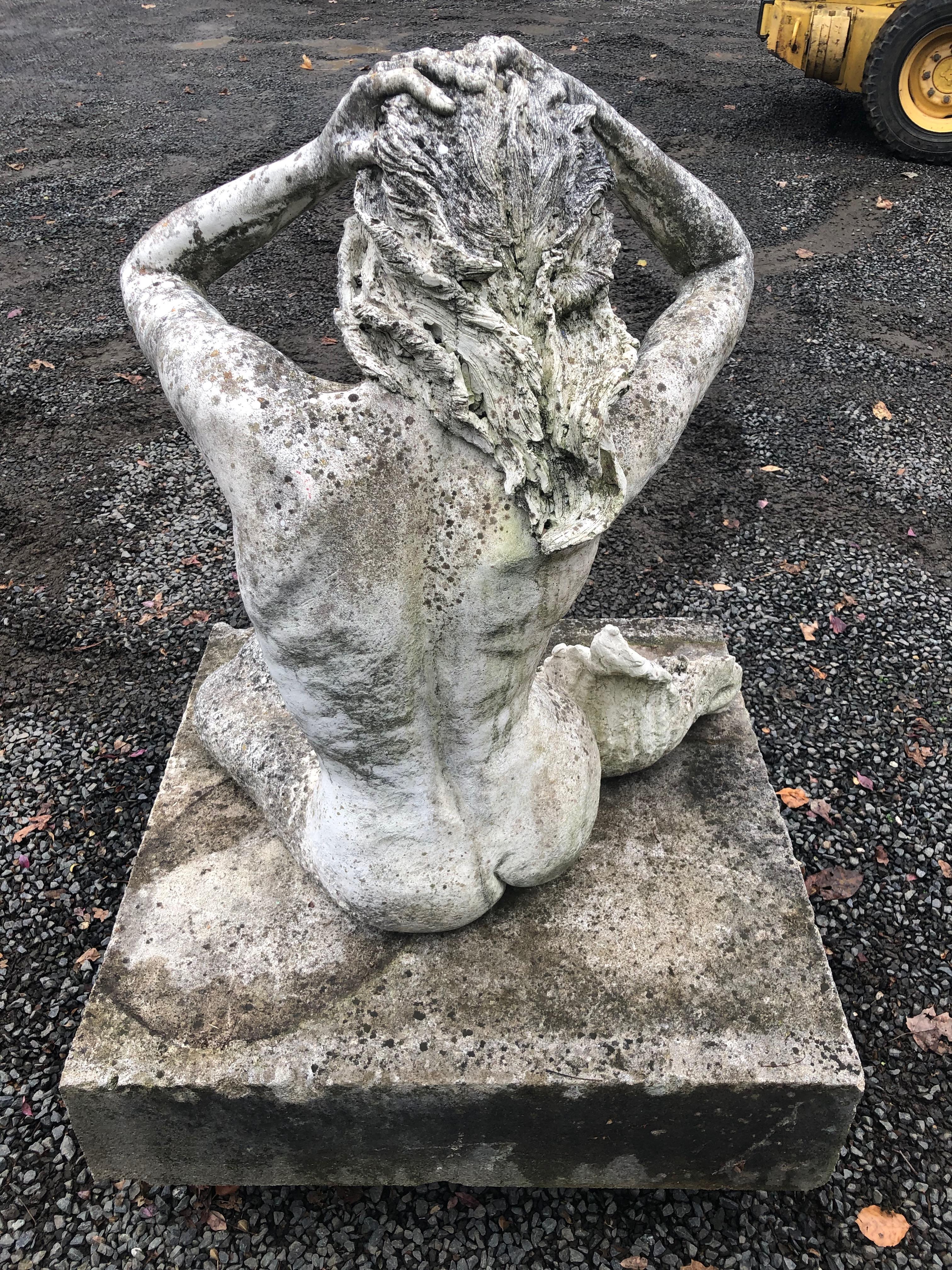 stone mermaid statue