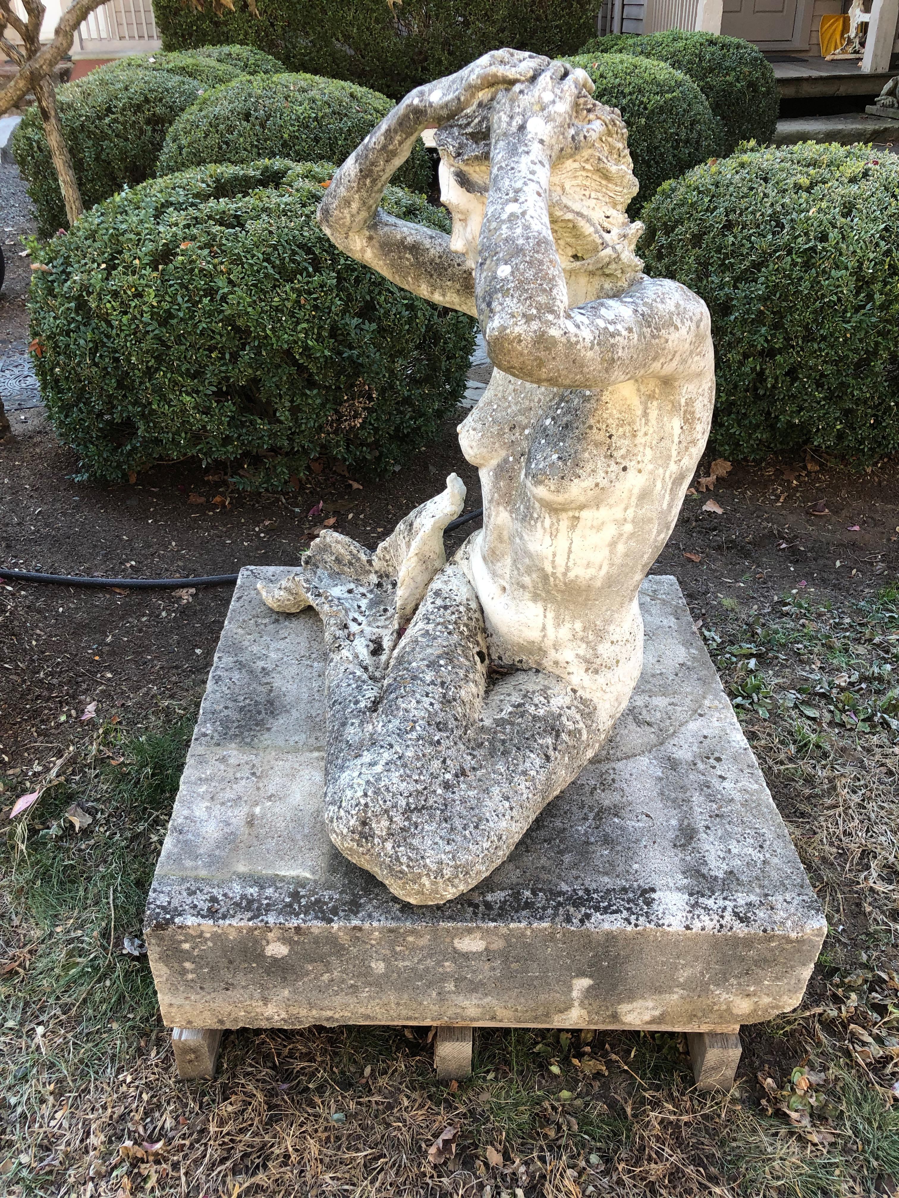 20th Century Life-Sized English Cast Stone Statue of a Mermaid Atop a Carved Stone Base