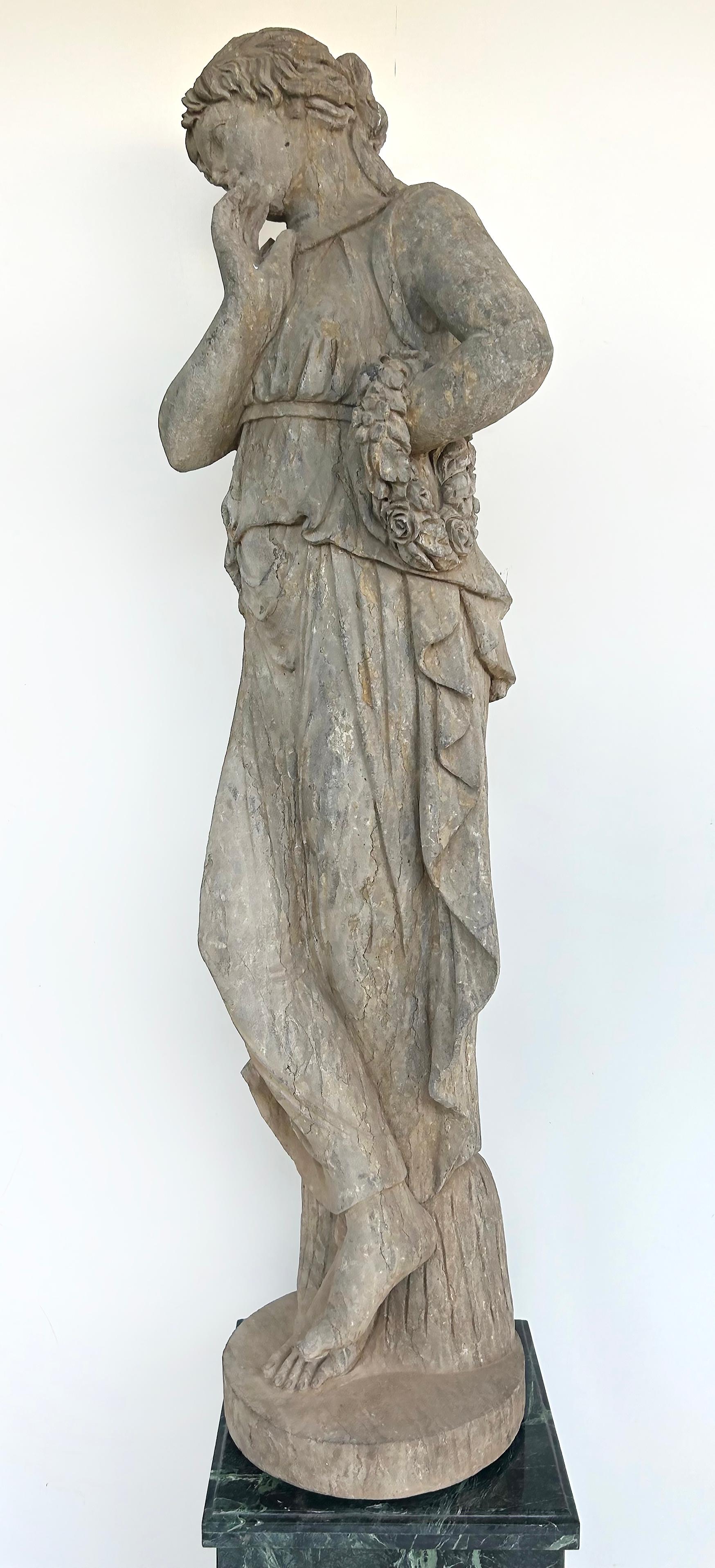 Lifesize Antique Classical Female Carved  Stone Statue on a Marble Base

Offered for sale is an antique carved stone classical figurative sculpture of a woman or possibly a dancer posing while leaning on a tree stump or pedestal. 
 This life-size