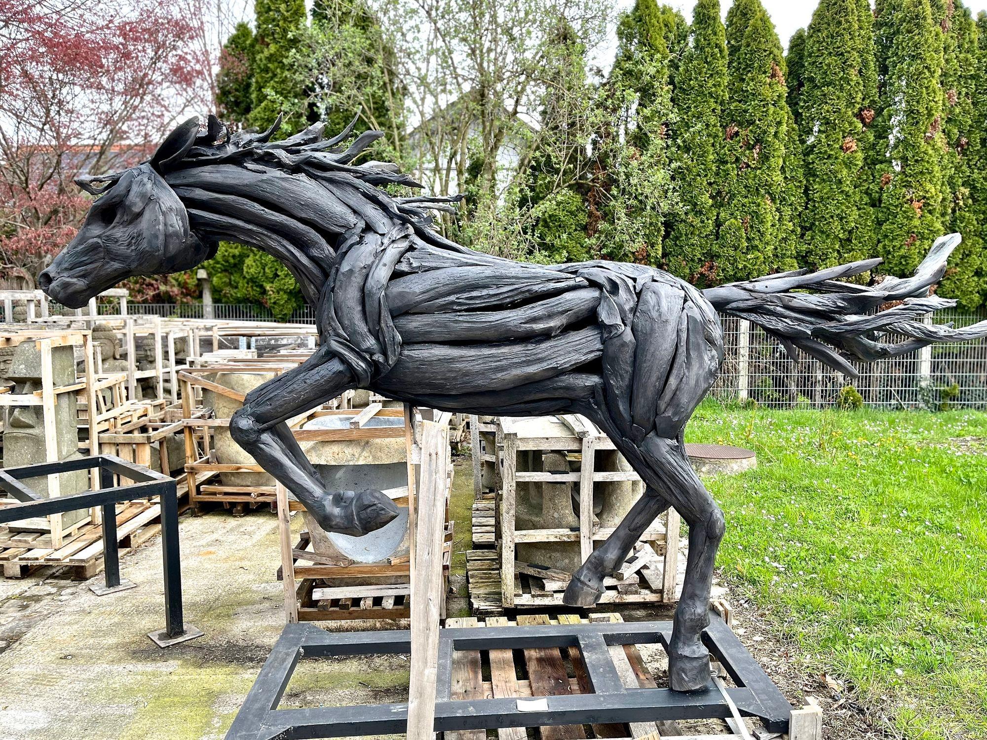 Outstanding lifesize sculpture of a spriting mustang artfully handcrafted by an exceptional indonesian artist. Elaborately created out of unique handpicked driftwood pieces that were collected on the beaches, this horse impresses with absolute