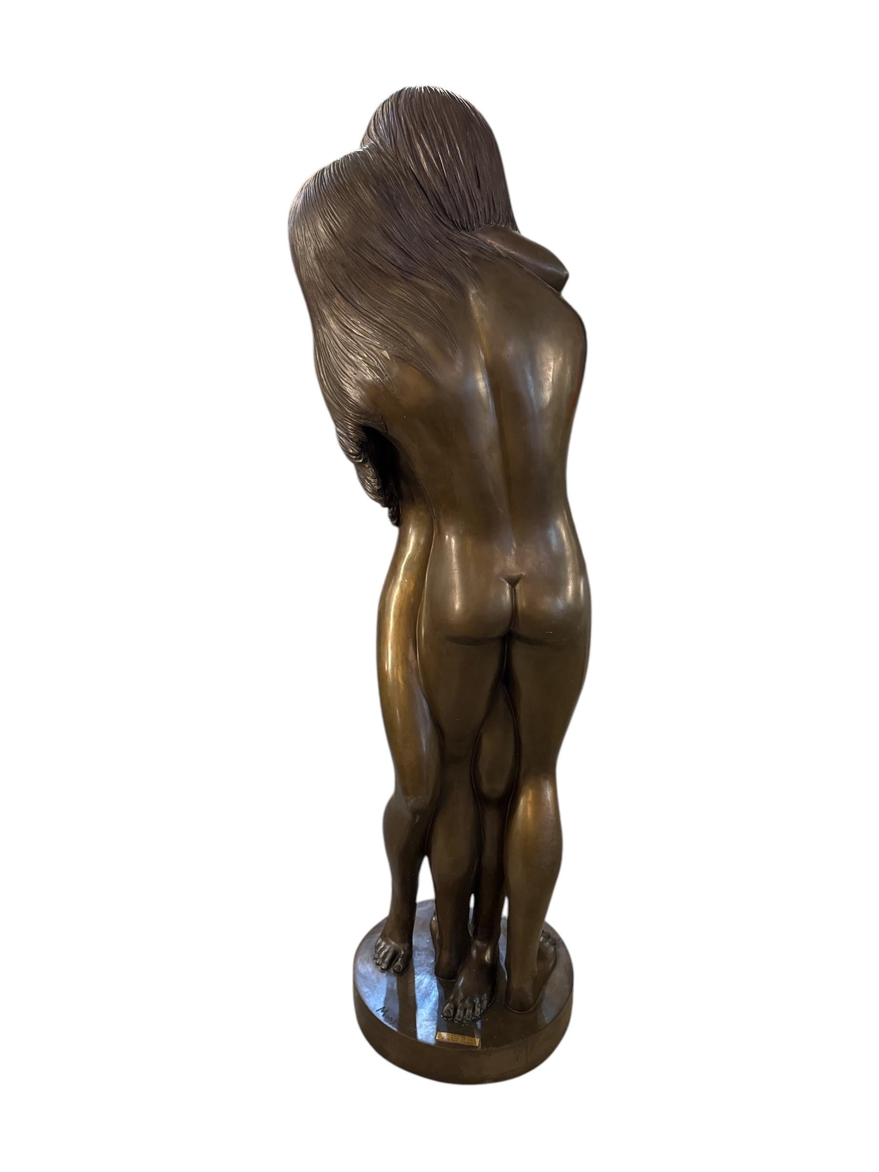 This Lifesize Bronze Statue of a Man and a Girl Hugging, created by the renowned artist Prince Monyo Mihailescu, beautifully captures a moment of warmth, tenderness, and connection. Crafted with exquisite detail, the statue portrays the intimate