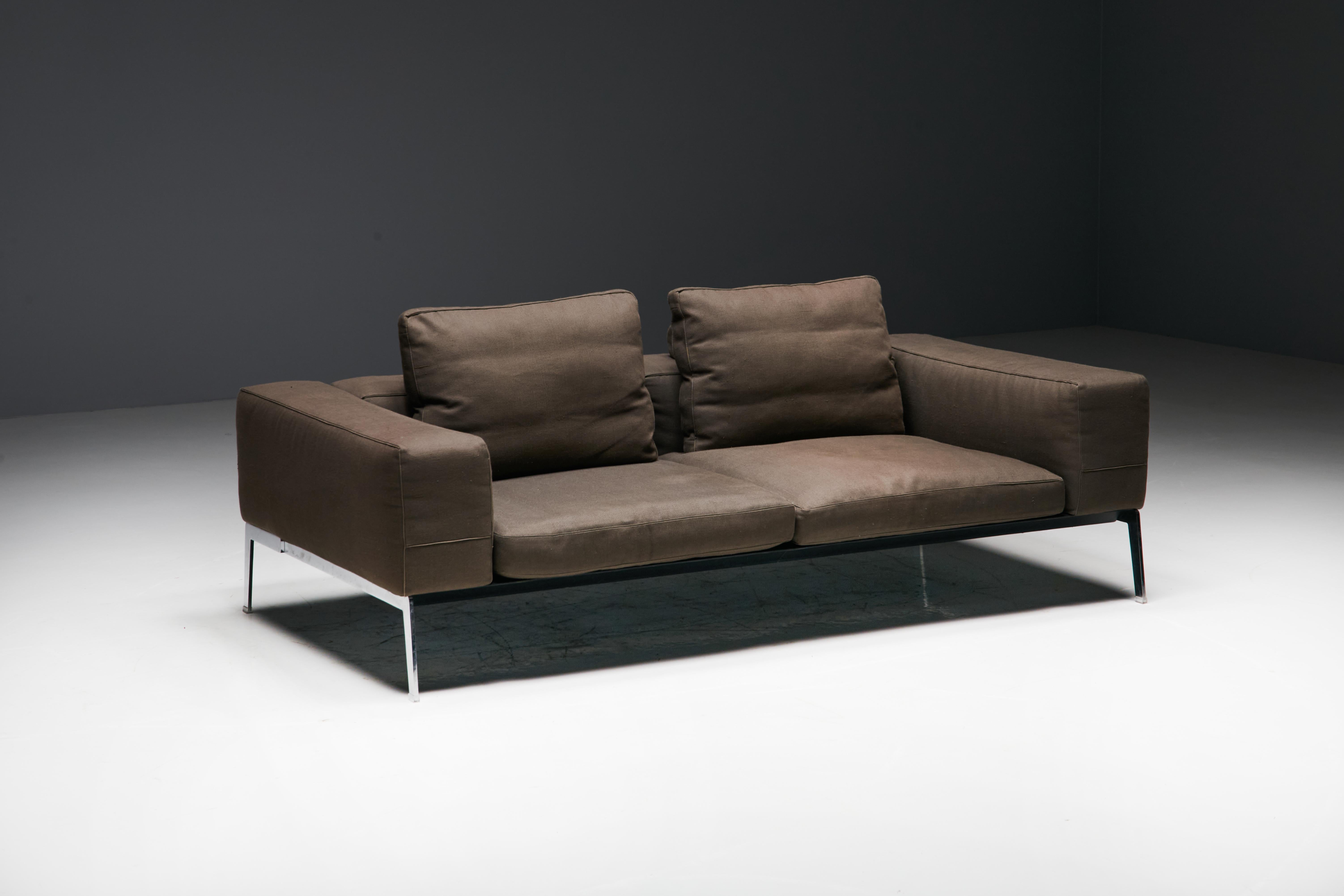 Lifesteel two-seater sofa by Antonio Citterio for Flexform, the embodiment of contemporary luxury and timeless design. The Lifesteel sofa features a striking metal base and finely upholstered frame, designed with a keen eye for aesthetics and