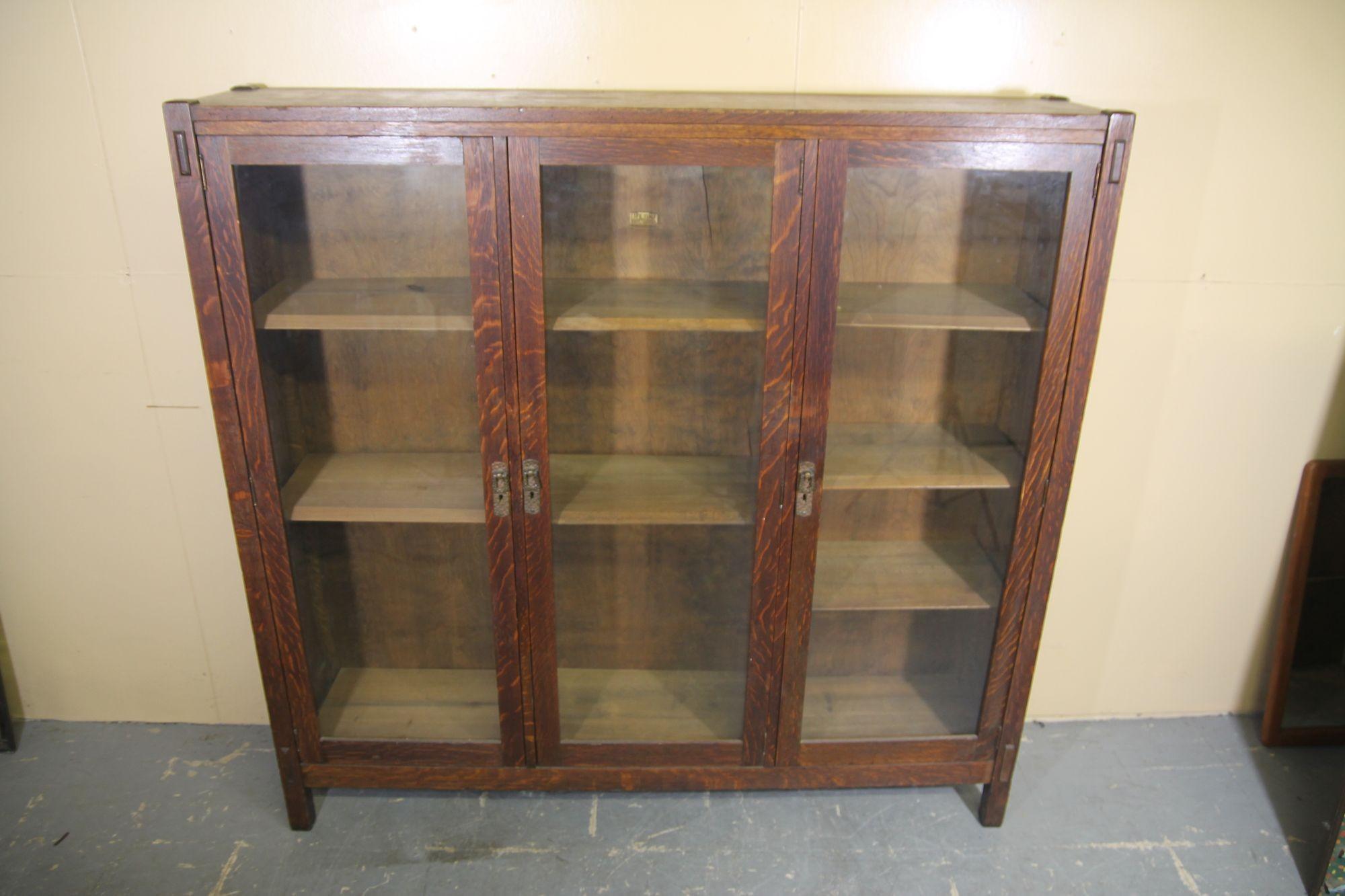 Im pleased to offer a great 3 door bookcase from Lifetime. This bookcase is in nice vintage condition and retains its original hand made handles and manufactures tag. The bookcase also has its original finish.