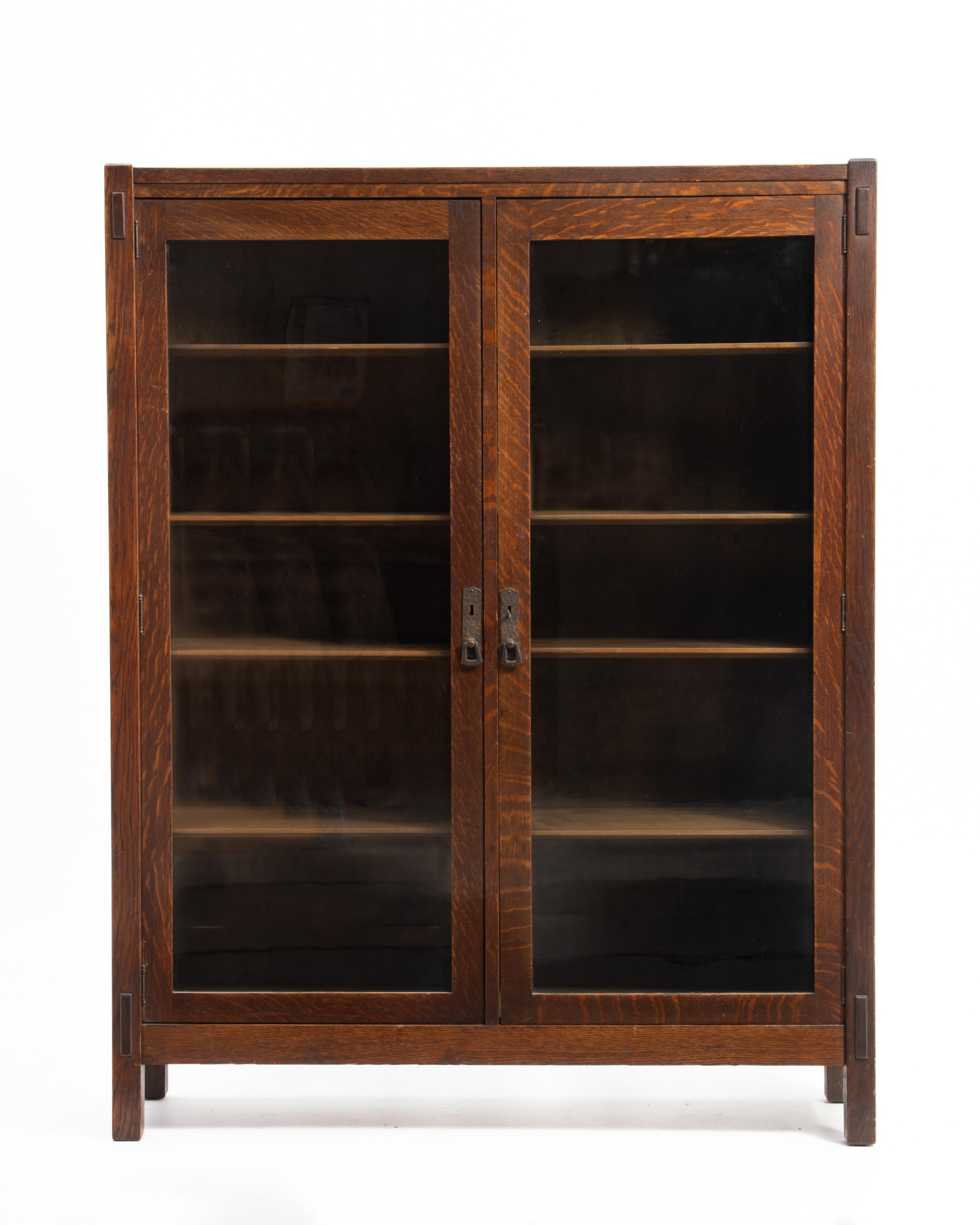 A beautiful, very well made and clean Mission Oak or Arts & Crafts bookcase, ca. 1905. 

Made by the Lifetime Furniture Company the bookcase retains the original medium brown finish. 

The bookcase features through tenons that are pegged on the top