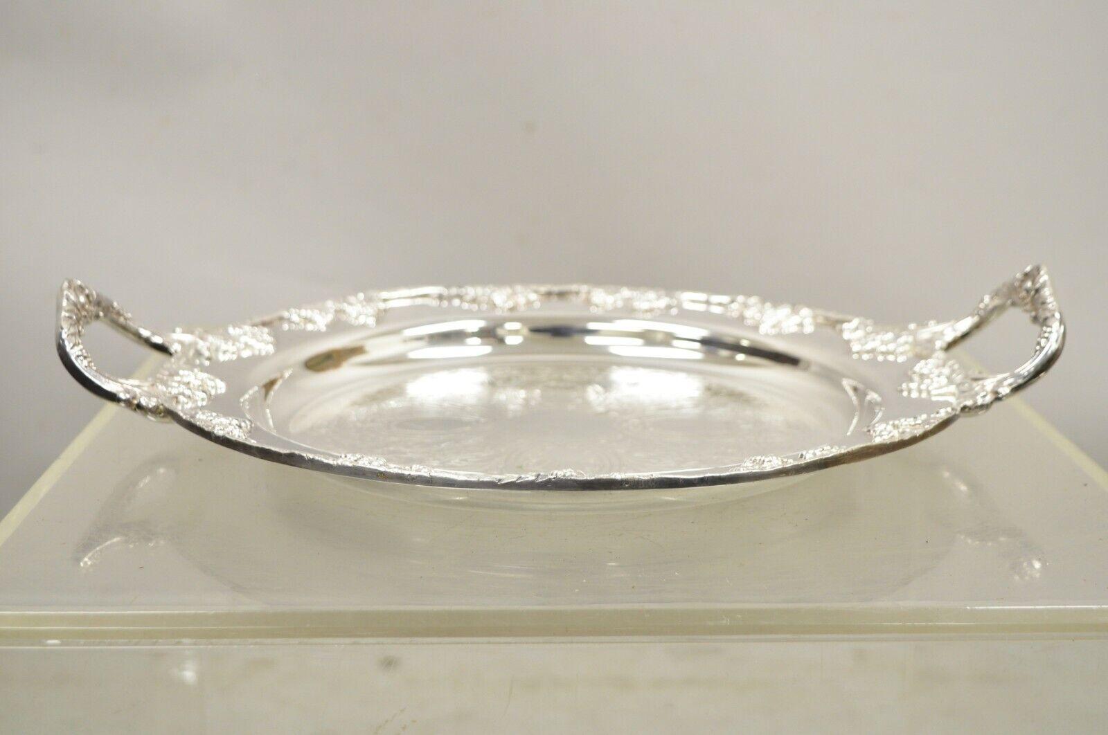Lifetime Brand English Silver Plate Twin Handle Grapevine Round Serving Tray. Circa Mid 20th Century. Measurements: 2.5