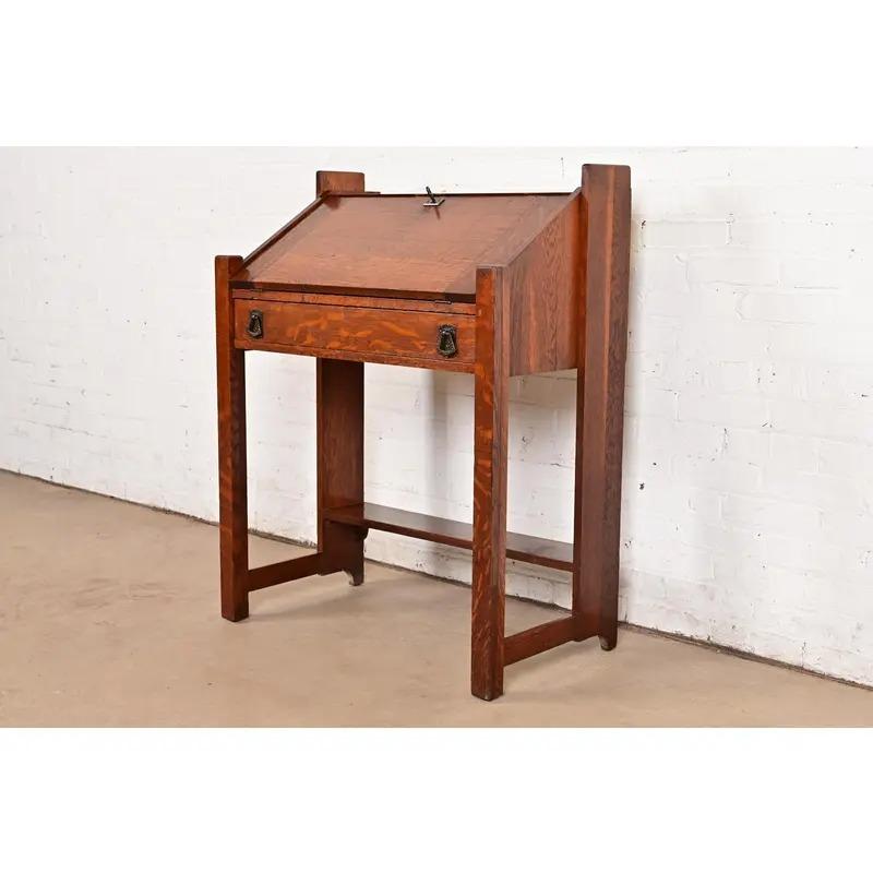 An exceptional antique Mission or Arts & Crafts period petite drop front secretary desk

By Lifetime Furniture

USA, Circa 1900

Gorgeous quarter sawn oak, with original hammered copper hardware. 

Measures: 30
