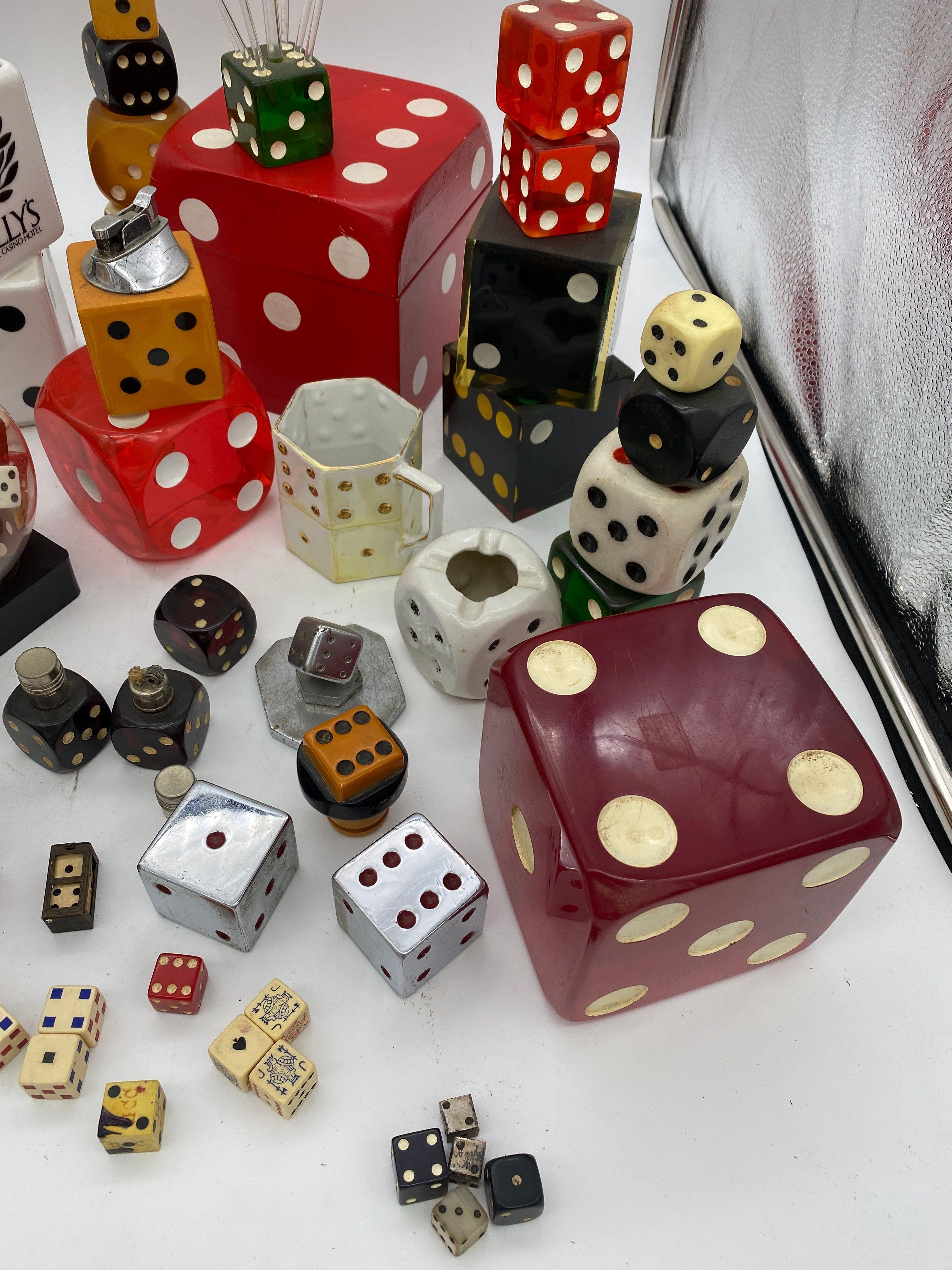 From the personal collection of Harvey Schwartz owner of this store Harvey's on Beverly is a large collection of dice including music boxes, clocks, lighters, swizzle sticks, ashtrays, display pieces, large dice, small dice. all made with variety of