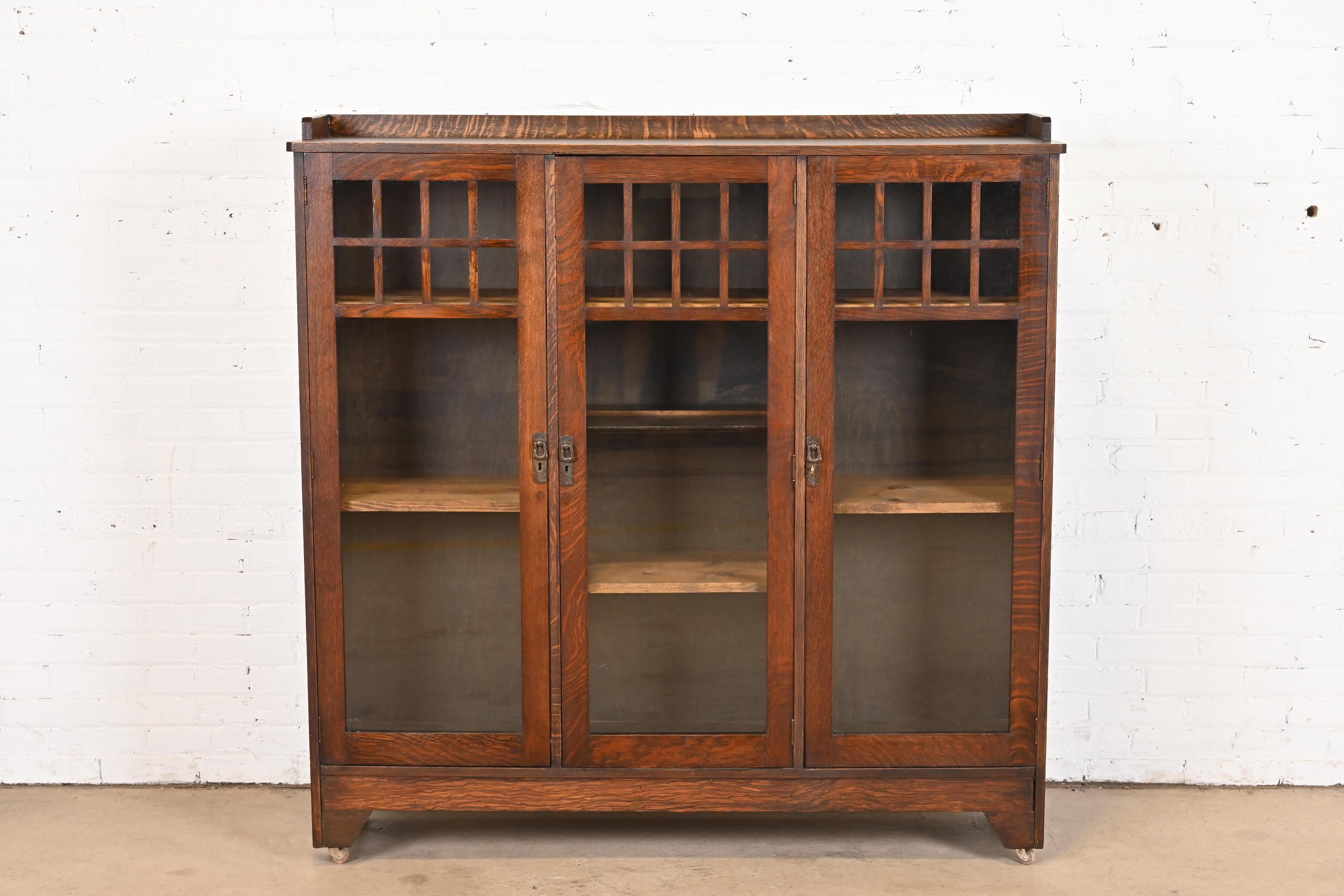 A gorgeous antique Mission or Arts & Crafts triple bookcase cabinet

By Lifetime Furniture

USA, Circa 1900

Quarter sawn oak, with mullioned glass front doors, and original hammered copper hardware. Shelves are adjustable and removable.

Measures:
