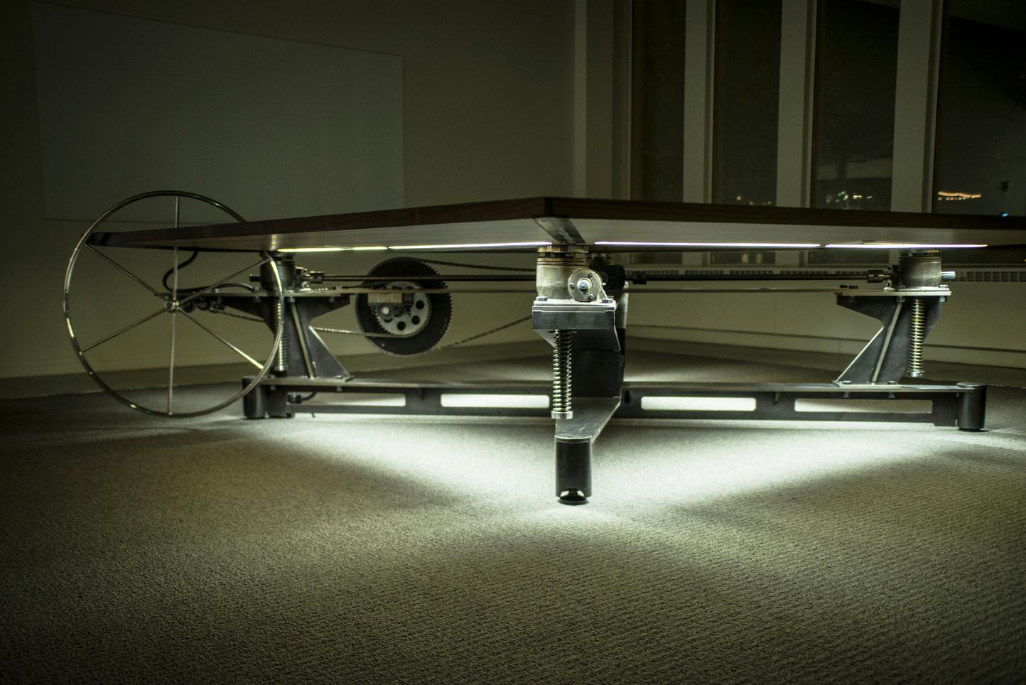 A culmination of steel, wood and glass make for one of the most incredible conference tables ever constructed. This table features under lighting and power outlets under each wing of the table. These features can be optimized per your requirements.