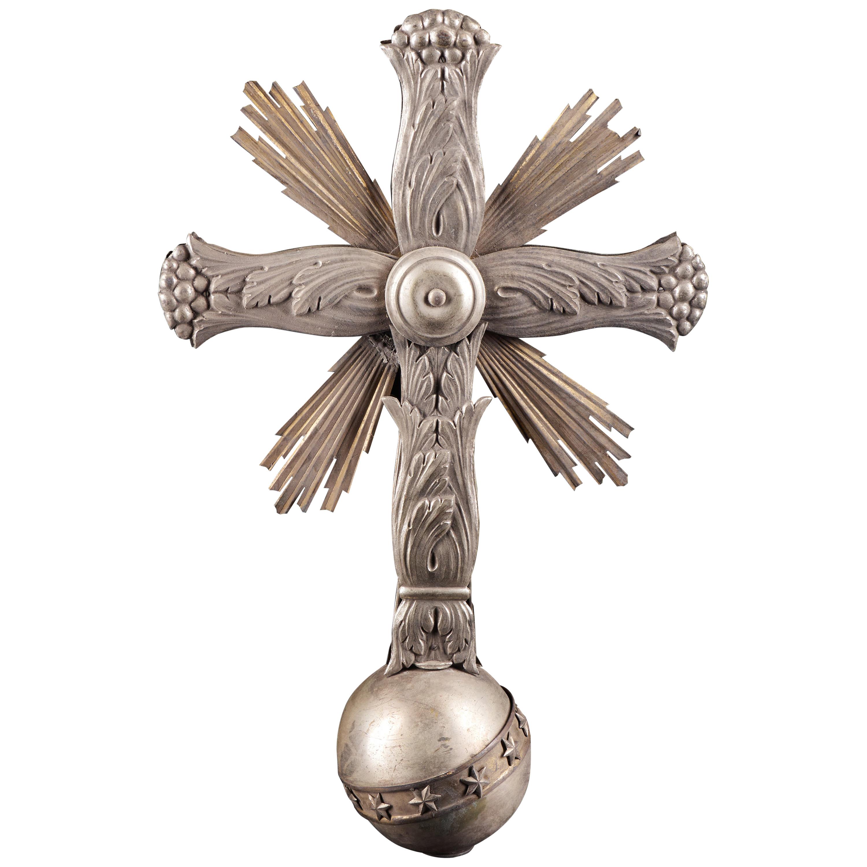 Light and Elaborately Decorated Antique Metal Cross on a Bowl