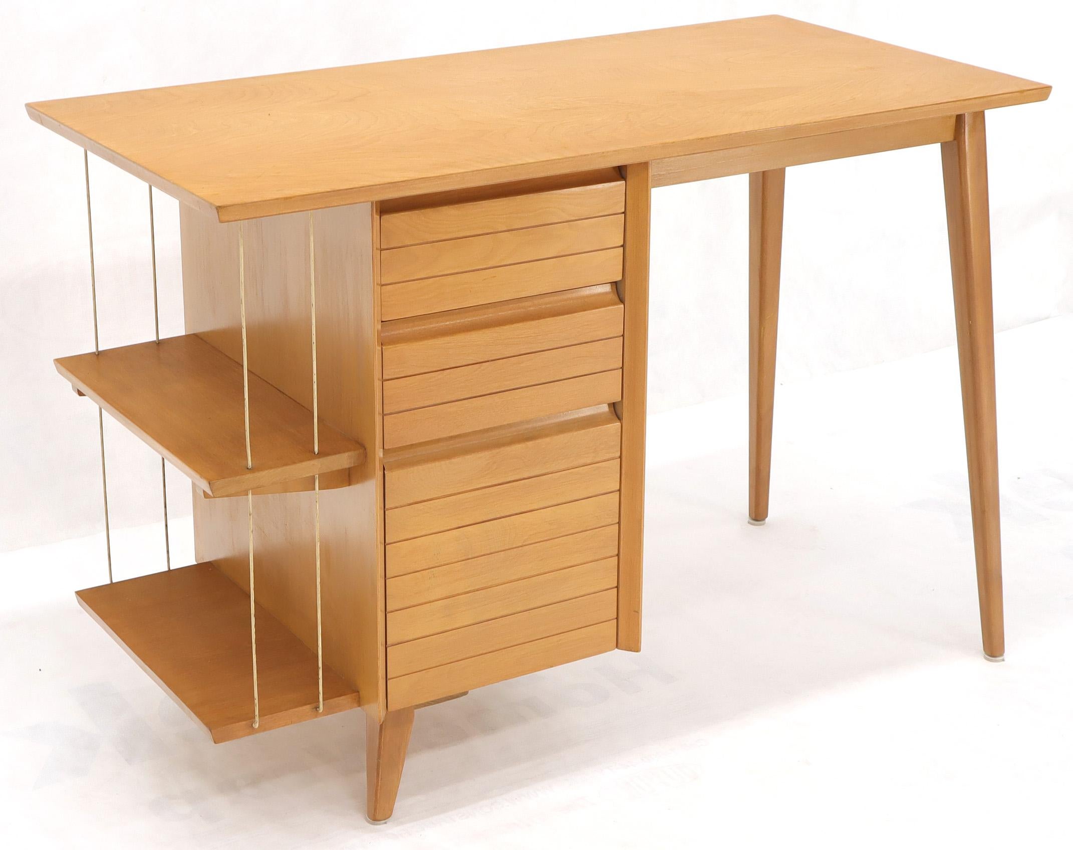 Mid-Century Modern petit light birch desk with bookcase and one file drawer. Unmarked in style of McCobb or Russel Wright. Very good original condition. Smoothly sliding drawers.