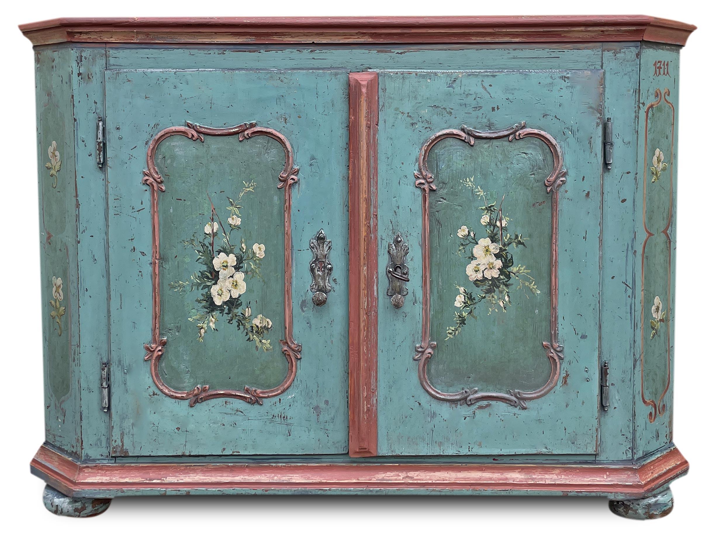 Tyrolean Painted Sideboard Dated 1711

Epoca: 1711	           
Origin: Tyrol	           
Wood: Fir	   
Measurements:  Height: 93cm - Width: 125 cm - Depth: 45 cm

Rare and beautiful painted sideboard with two doors, entirely painted in intense blue.