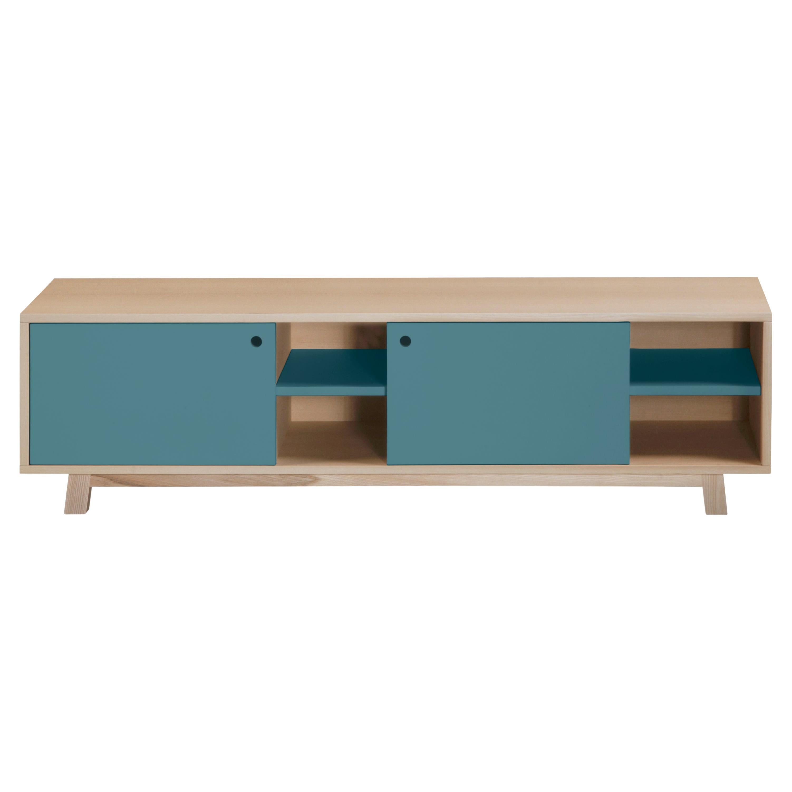 This TV stand with 2 sliding doors is designed by Eric Gizard - Paris.

It is 100% made in France with solid and veneer ash and lacquered MDF doors. 

To pull the door, use the round eyelet. 
2 adjustable wooden shelves on cleats are placed
