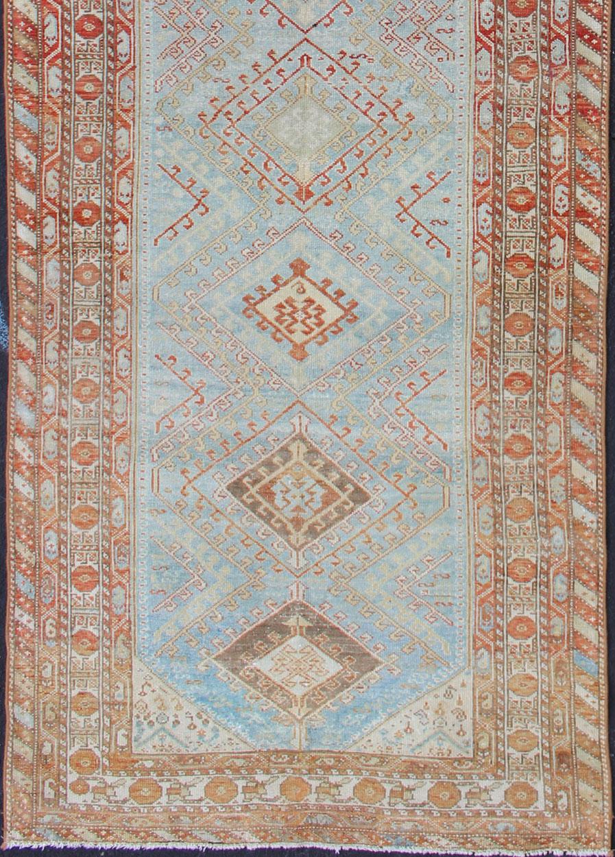 Tribal design Persian antique Malayer runner in blue, red, orange, rug SUS-2009-658, country of origin / type: Iran / Mahal, circa 1920

This antique Persian Malayer runner, circa early 20th century, relies heavily on exquisite details as well as