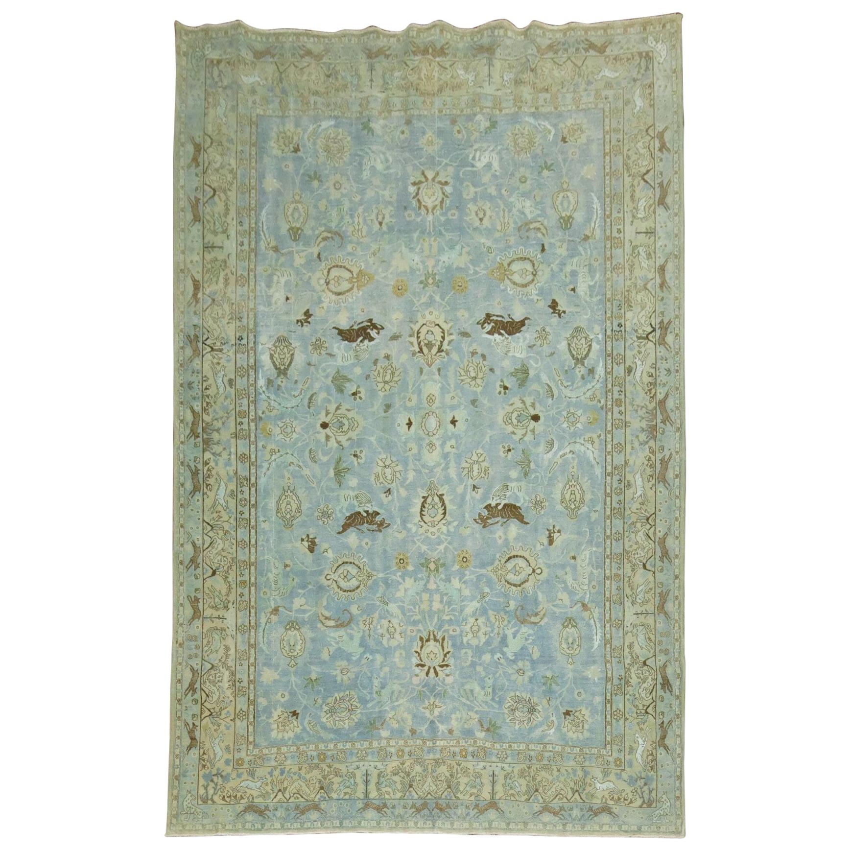 early 20th century Persian Tabriz Pictorial rug in predominant light blue featuring a flurry of animals floating in field and border. majority of the animals look like sea horses and reindeers

Measures: 6'8