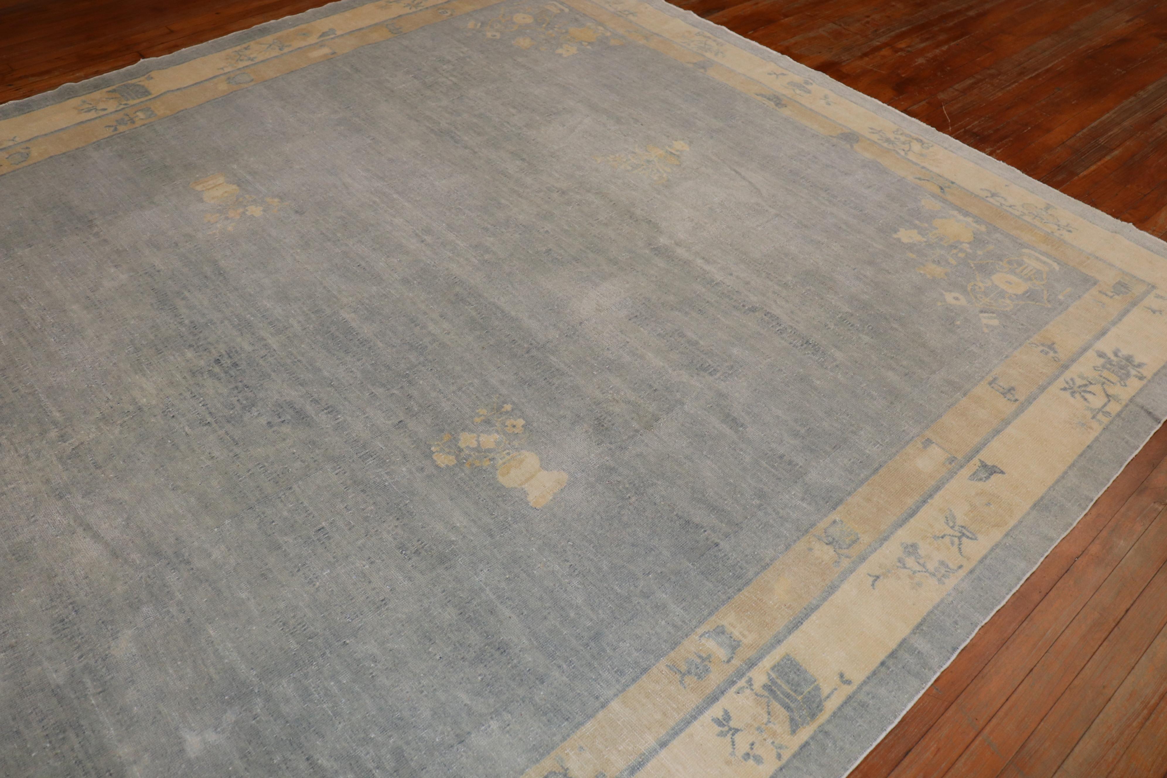 An early 20th century room size neutral color Chinese rug.

Measures: 9'2'' x 11'5''.