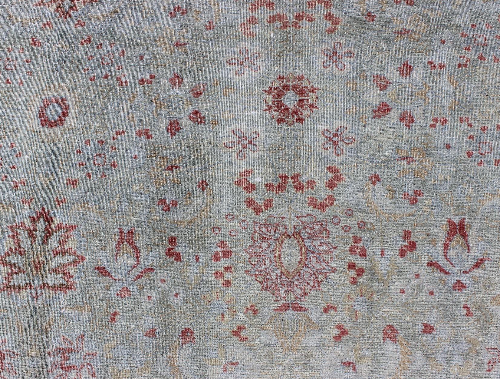 Wool Light Blue Antique Persian Tabriz Rug with Floral Design and Hints of Red For Sale