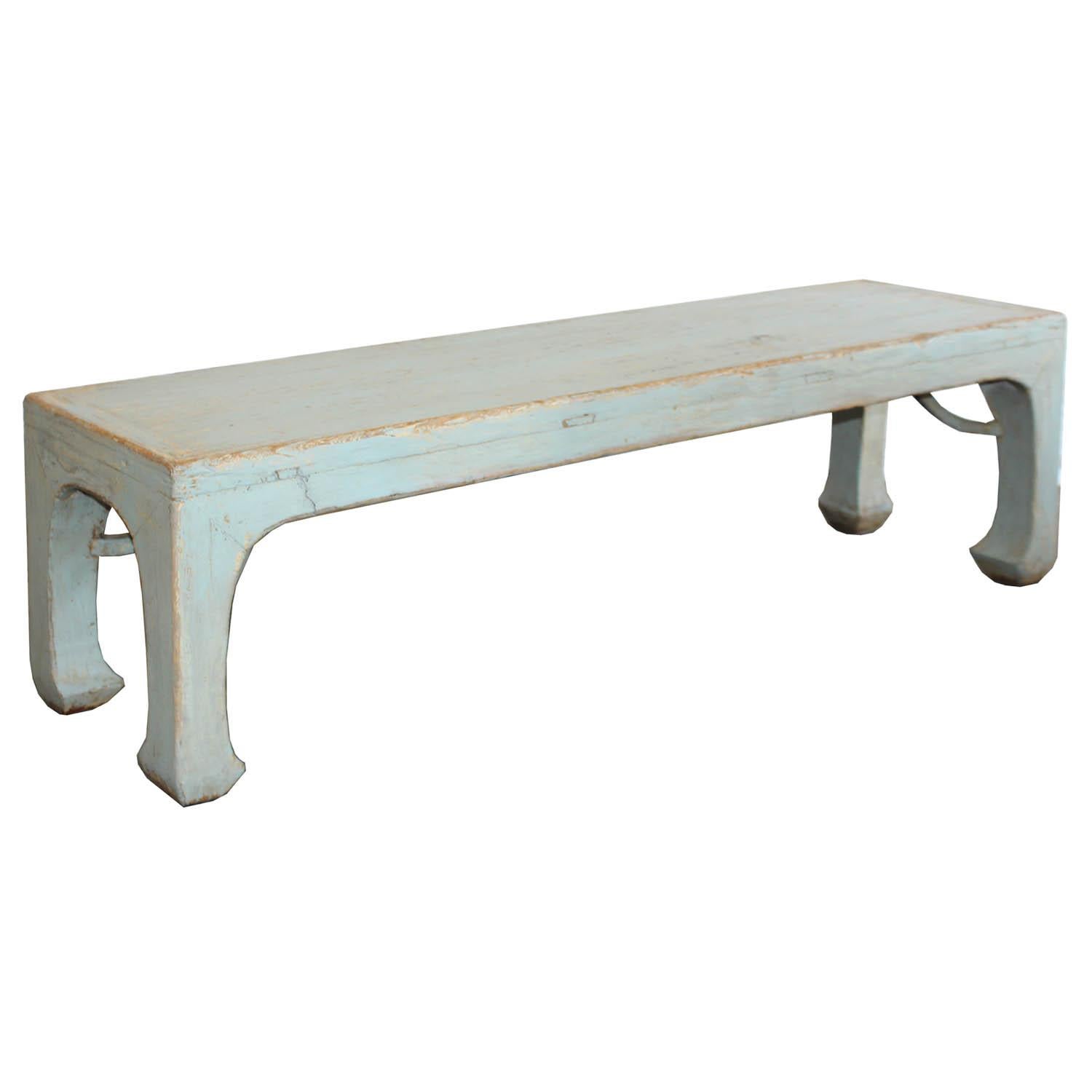 Long bench with matte blue finish. Curved arm braces below the top surface and horse hoof-style feet. Perfect at the end of the bed or use as extra seating in a contemporary interior.


