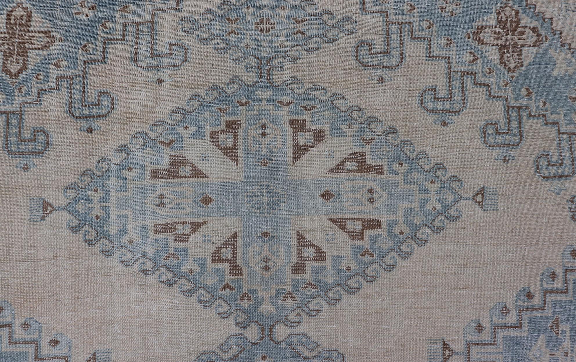 Persian Antique Tabriz Rug With Geometric Medallion With Latch Hooks in Light Blue

Persian Antique Tabriz Rug With Geometric Medallion with Latch Hooks. Keivan Woven Arts / rug EMB-9551-P13080, country of origin / type: Iran / Tabriz, circa