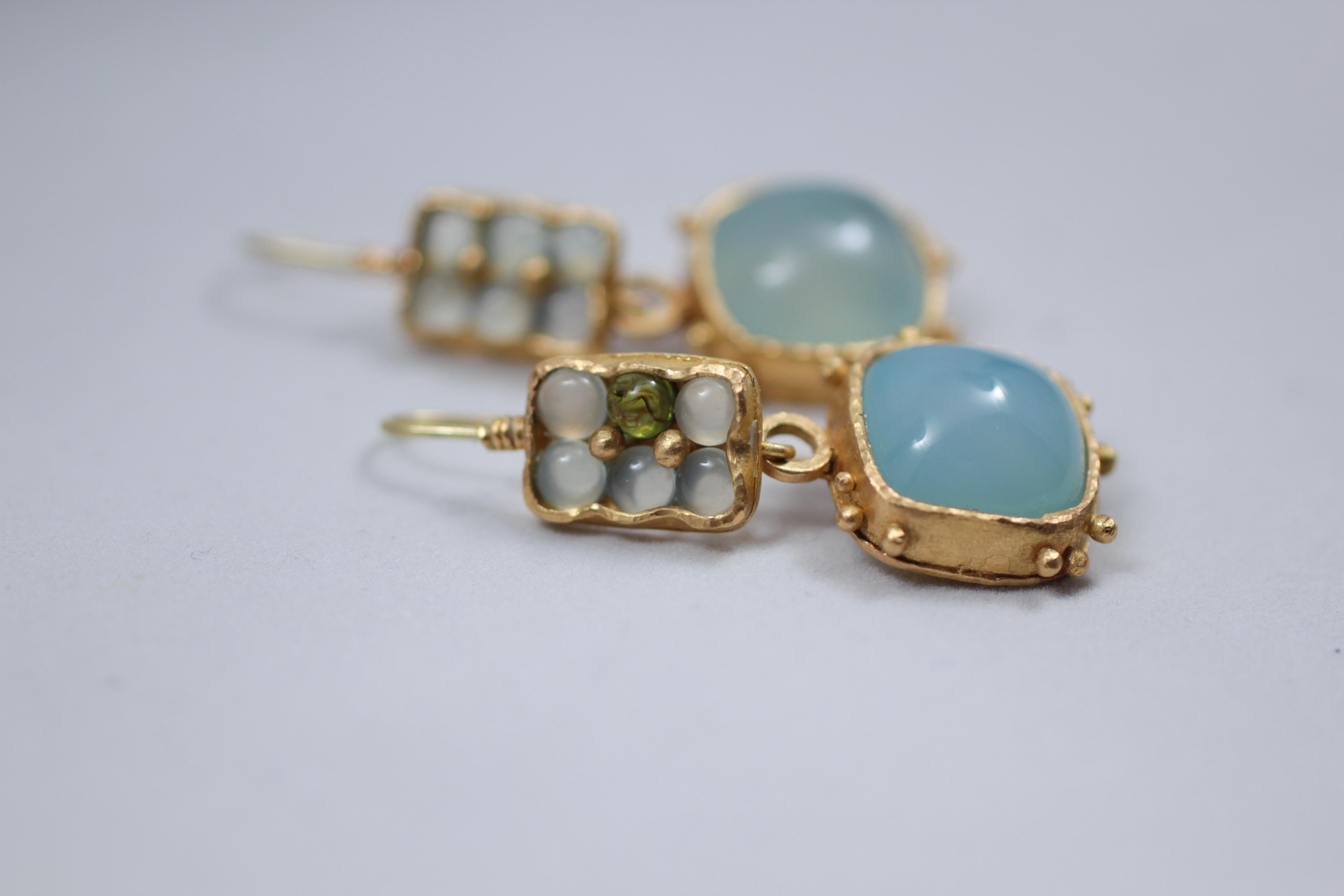 Watercolor Dangle Drop Earrings. Textured 21k solid gold handcrafted earrings featuring light blue chalcedony cabochon drops. Chalcedony and tourmaline small round cabs are set in whimsical bezels. Perfect for every occasion. Beautiful light blue
