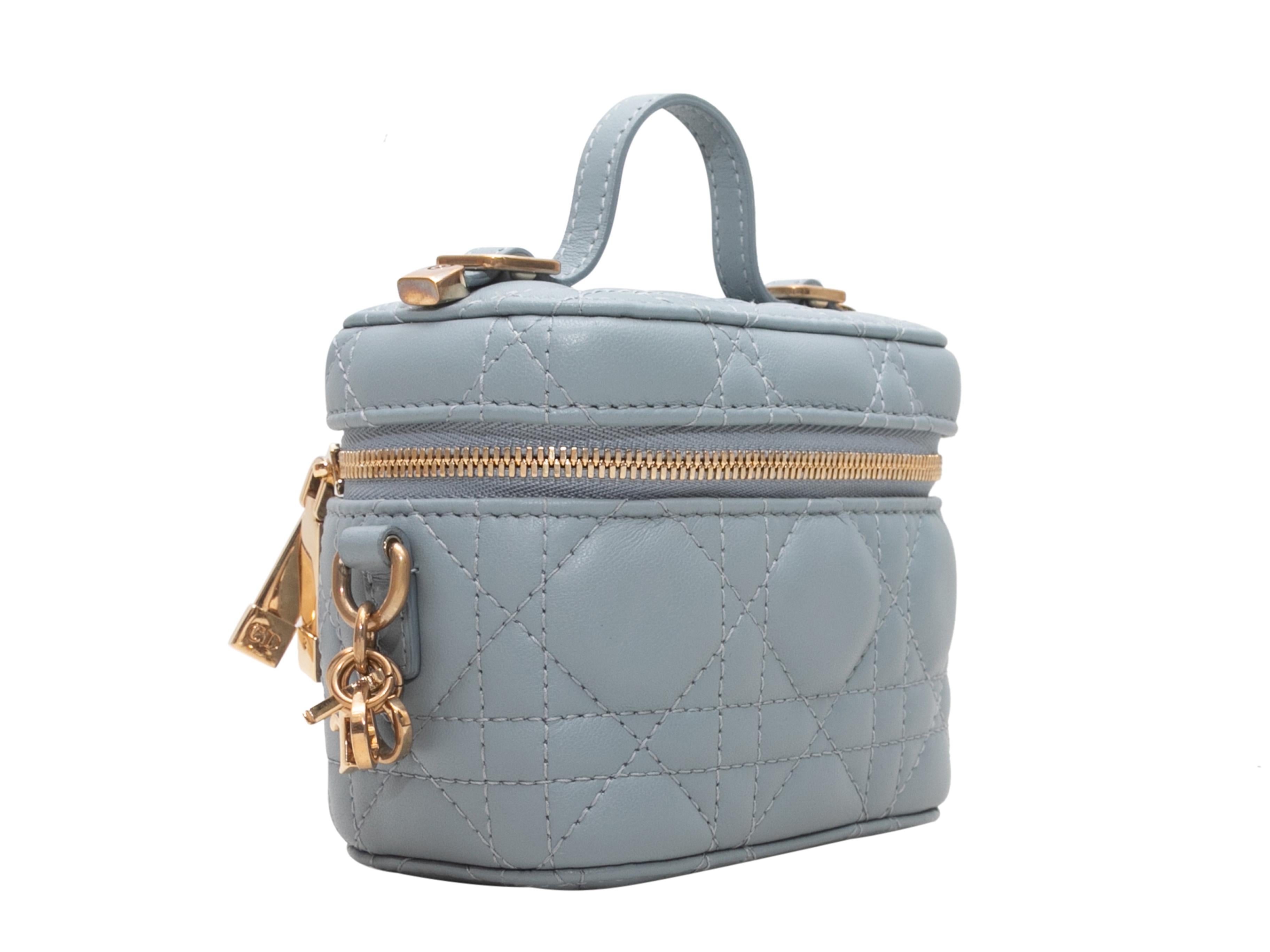 Light Blue Christian Dior Micro Lady Dior Cannage Vanity Case. The Lady Dior Cannage Vanity Case features a leather body, gold-tone hardware, a single flat top handle, a single adjustable shoulder strap, and a top zip closure. 5