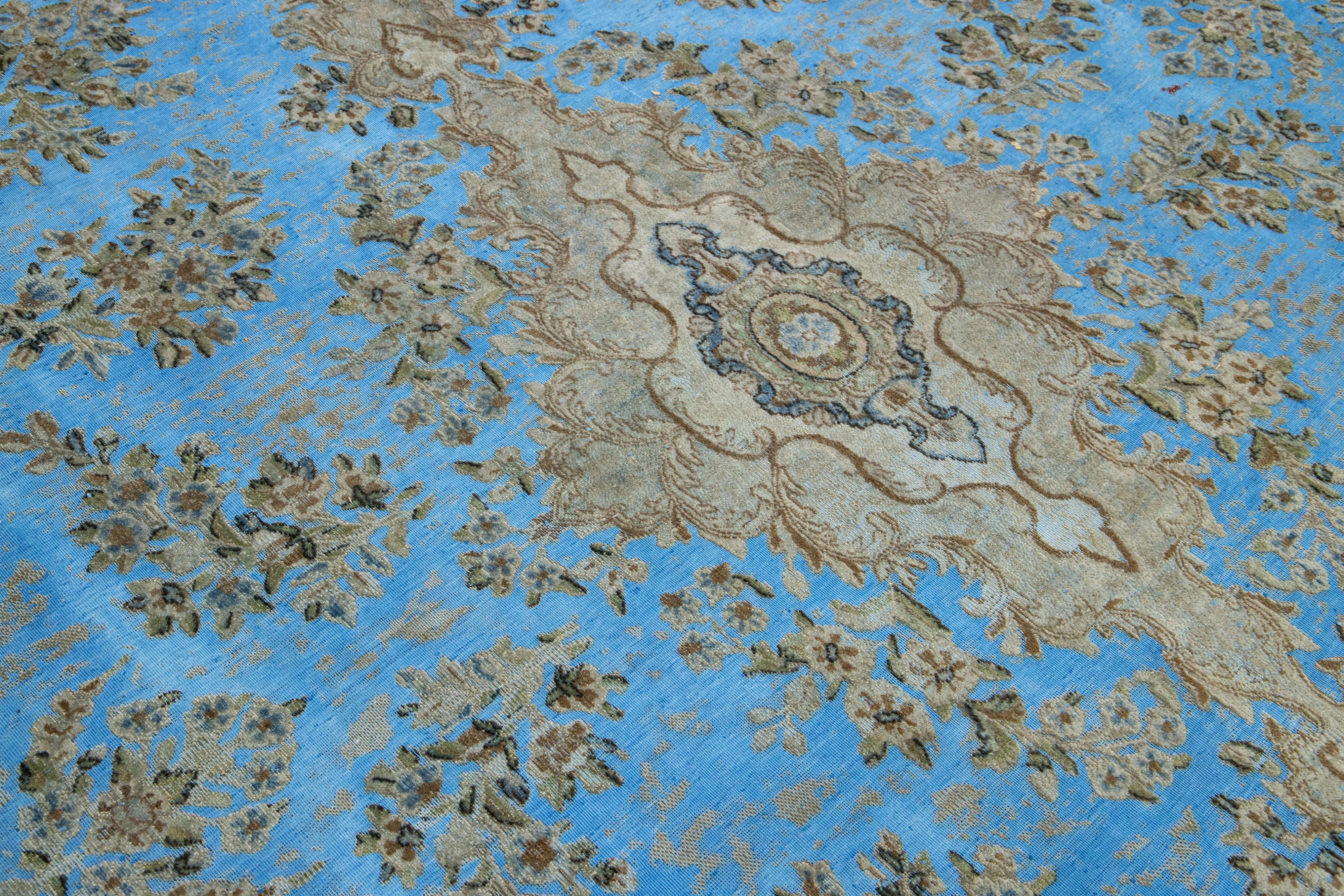 20th Century light Blue Floral Antique Persian Overdyed Wool Rug With Medallion Motif For Sale