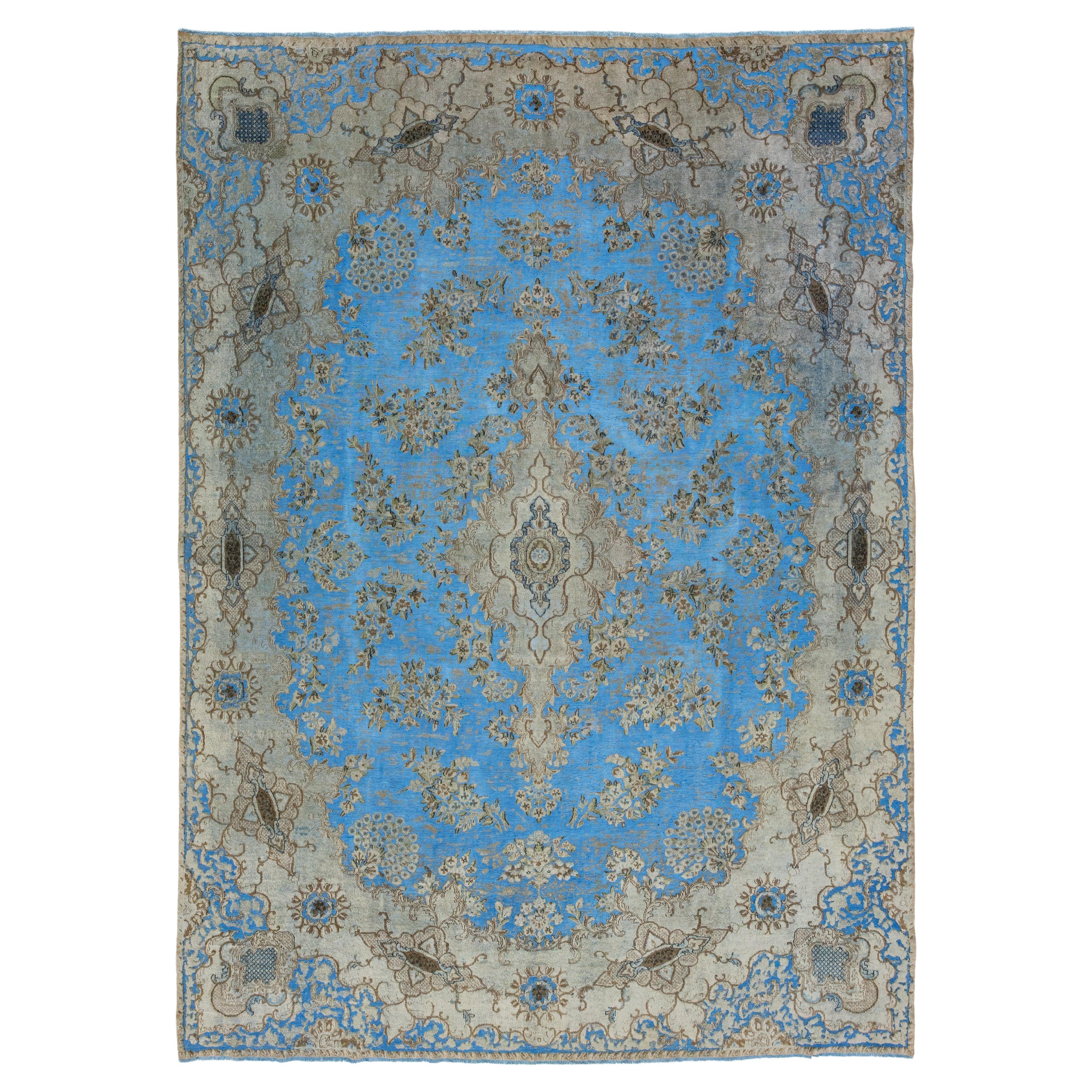 light Blue Floral Antique Persian Overdyed Wool Rug With Medallion Motif For Sale
