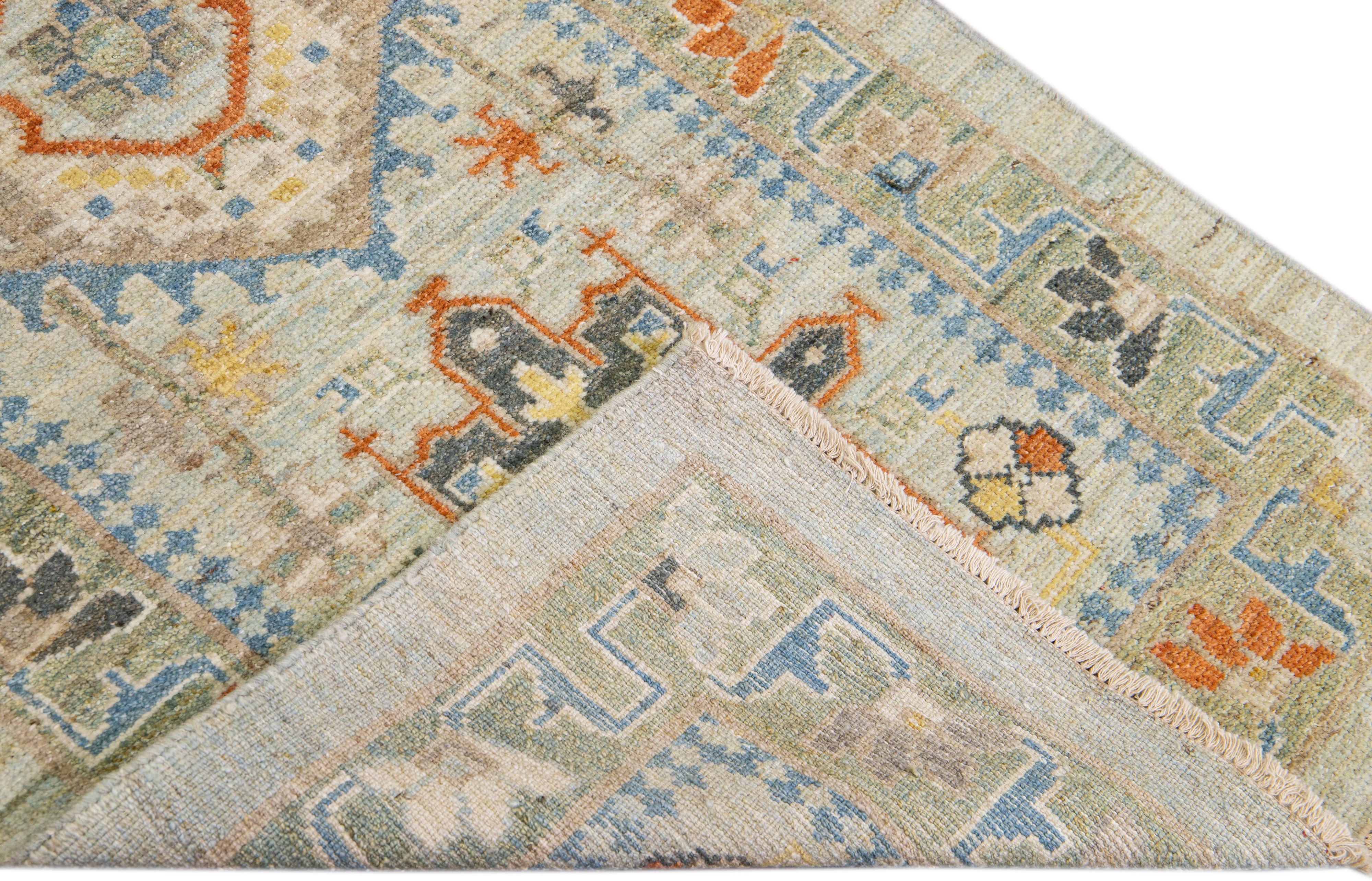 A beautiful modern Heriz hand-knotted wool runner with a light blue field. This Piece has multicolor accents in a gorgeous all-over Classic floral design.

This rug measures: 2'10'' x 23'9