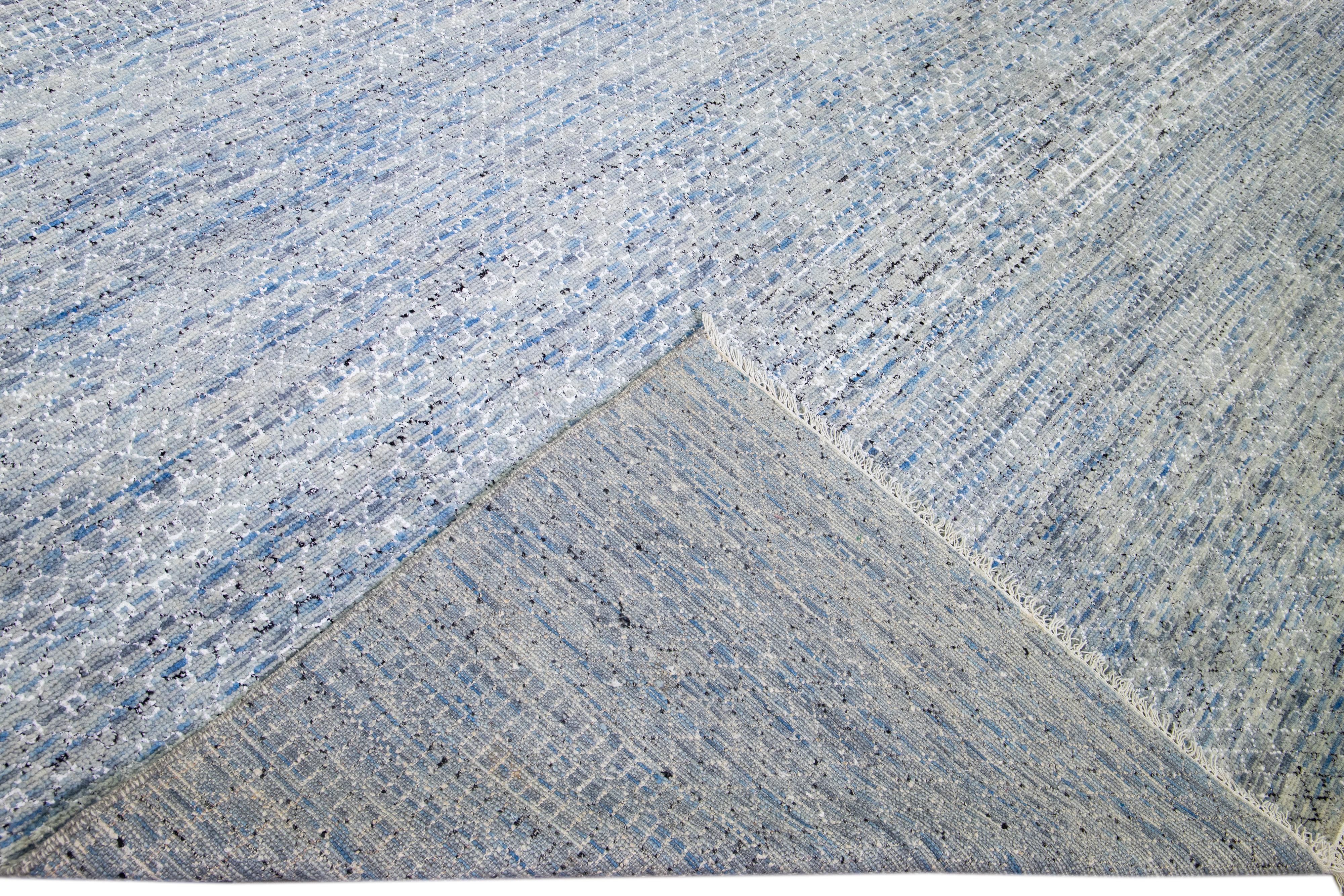 Beautiful Contemporary Savannah hand-knotted wool rug with a finely detailed light blue field in an all-over white geometric pattern design.

This rug measures: 16'1