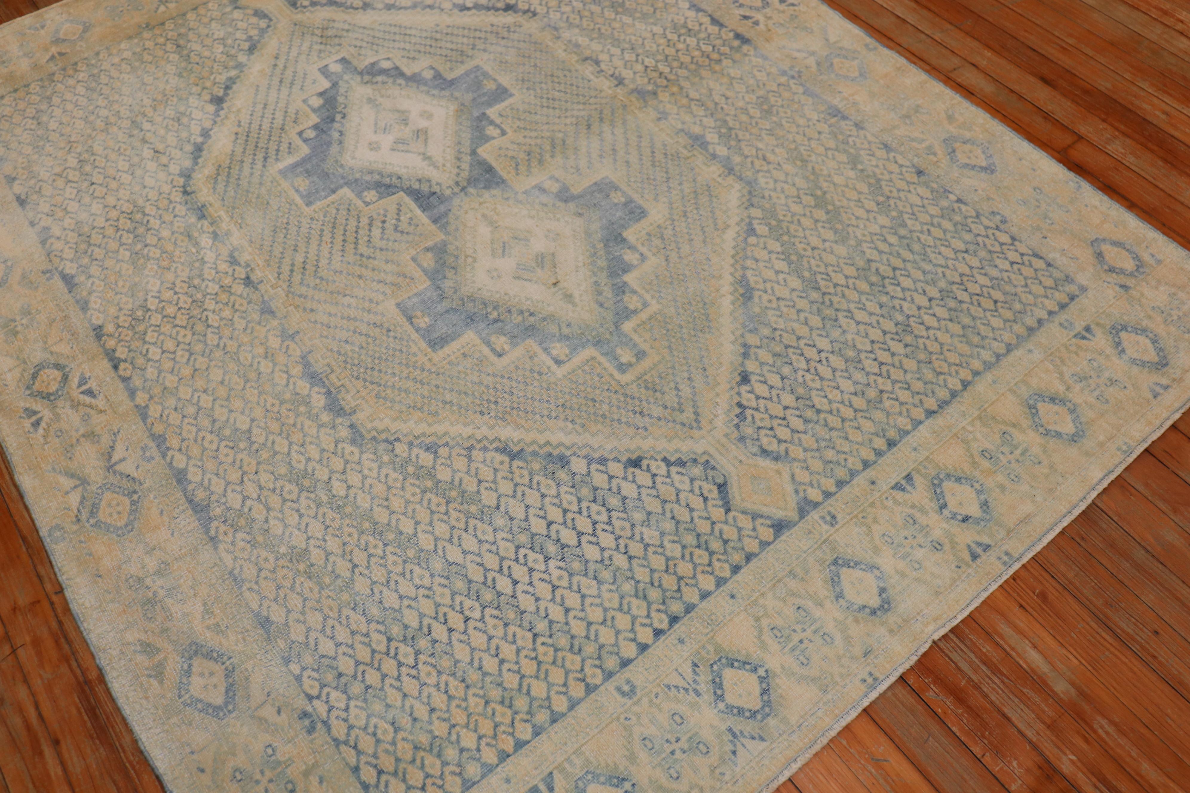 Mid 20th century Persian tribal rug in soft blue and sand tones

Measures: 5' x 6'4''.