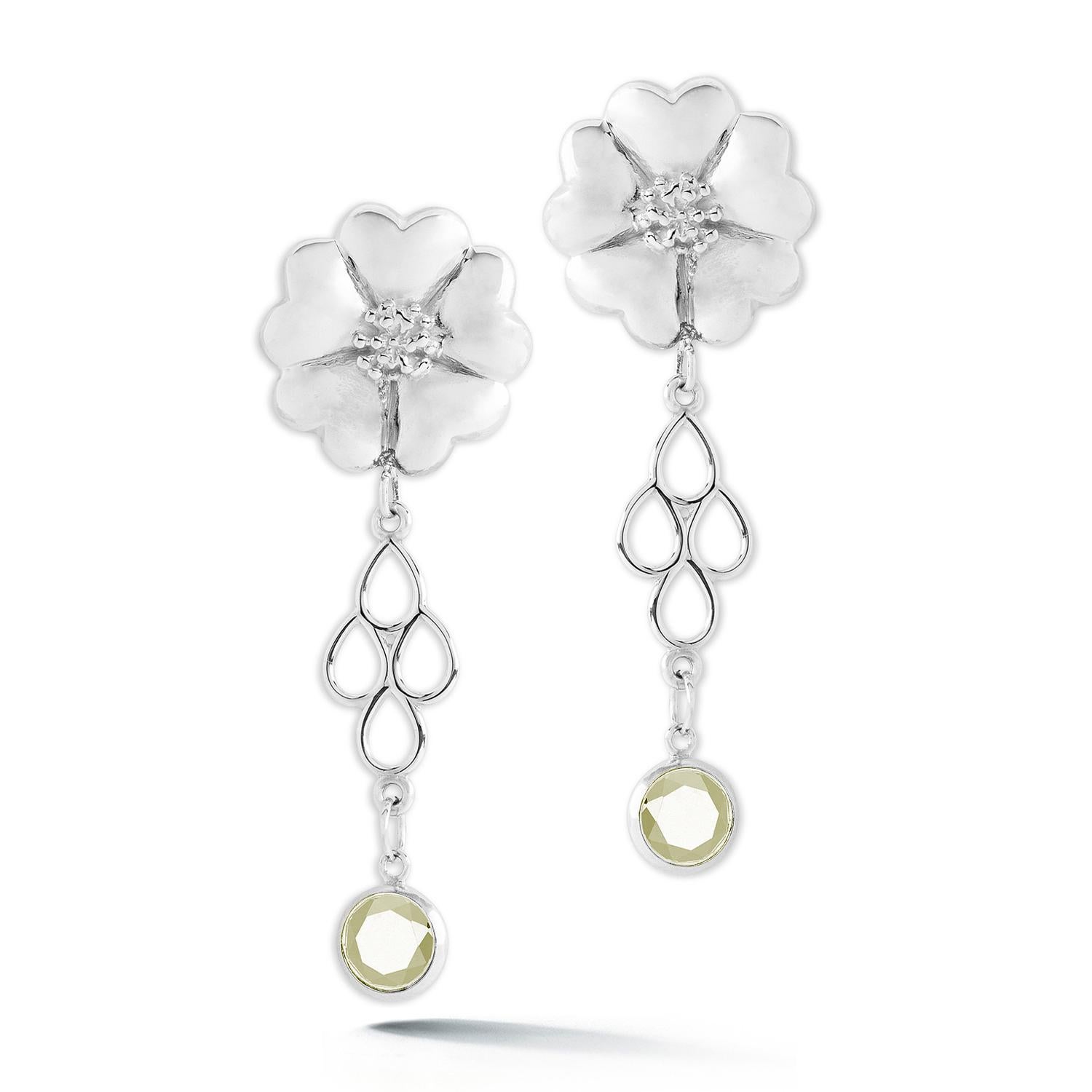 Designed in NYC

.925 Sterling Silver 2 x 6 mm Light Blue Topaz Blossom Stone Chandelier Earrings. No matter the season, allow natural beauty to surround you wherever you go. Blossom stone chandelier earrings: 

	Sterling silver 
	High-polish finish