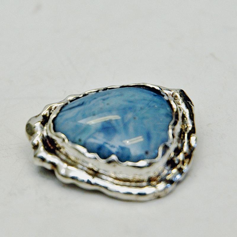 Beautiful light blue 'Bergslagen stone' silver brooch by Ove Nordström, Skinnskatteberg 1960s. Sweden. Lovely for every occasion.
The stone has various shades of blue color and are originally the 