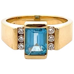 Hellblauer Topas und Diamantring aus 14k Gelbgold