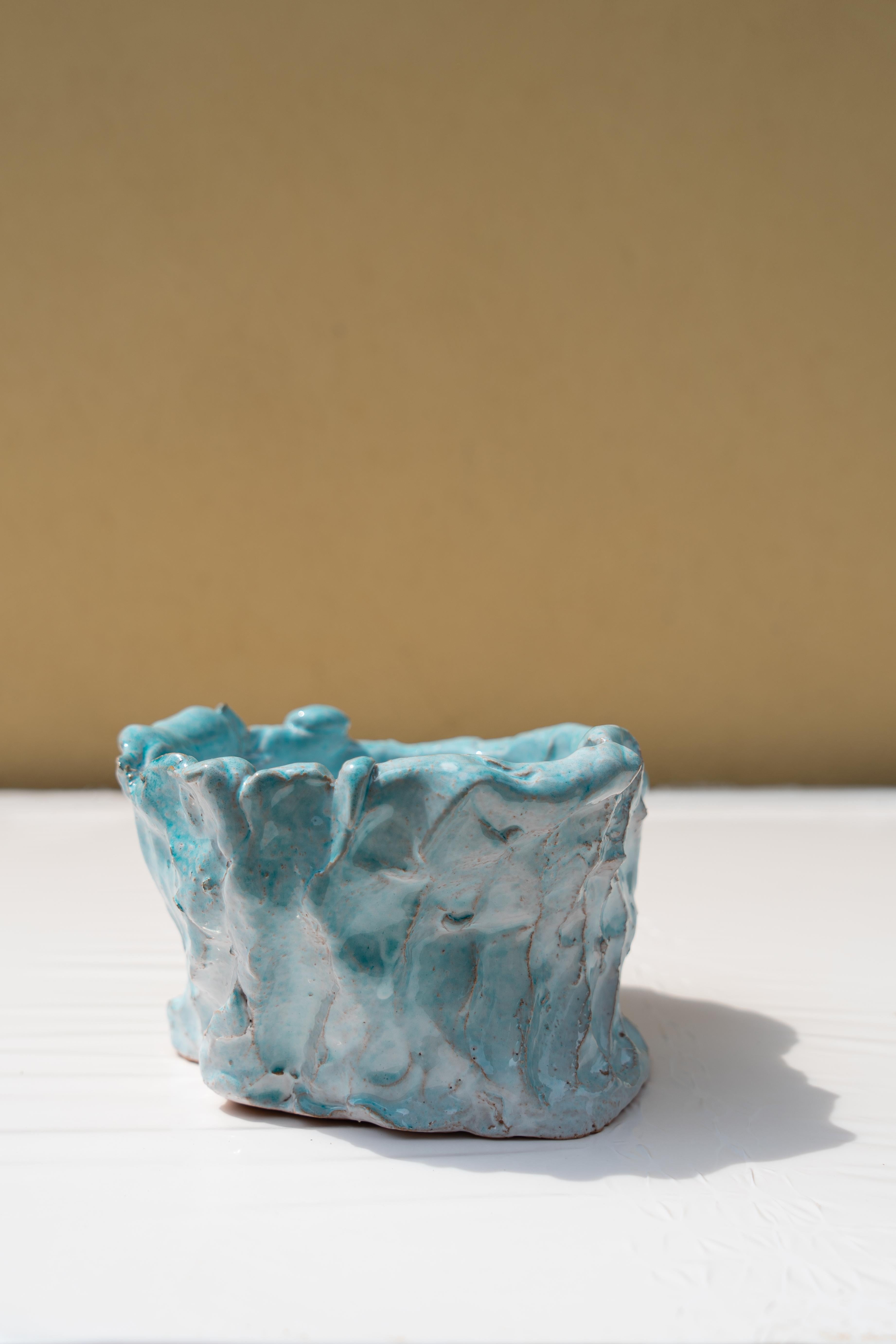 Light blue vase by Daniele Giannetti
Dimensions: Ø 16 x H 10 cm.
Materials: Glazed terracotta. 

All pieces are made in terracotta from Montelupo, only fired once, then colored by Daniele Giannetti with a white acrylic base, and then a mixture