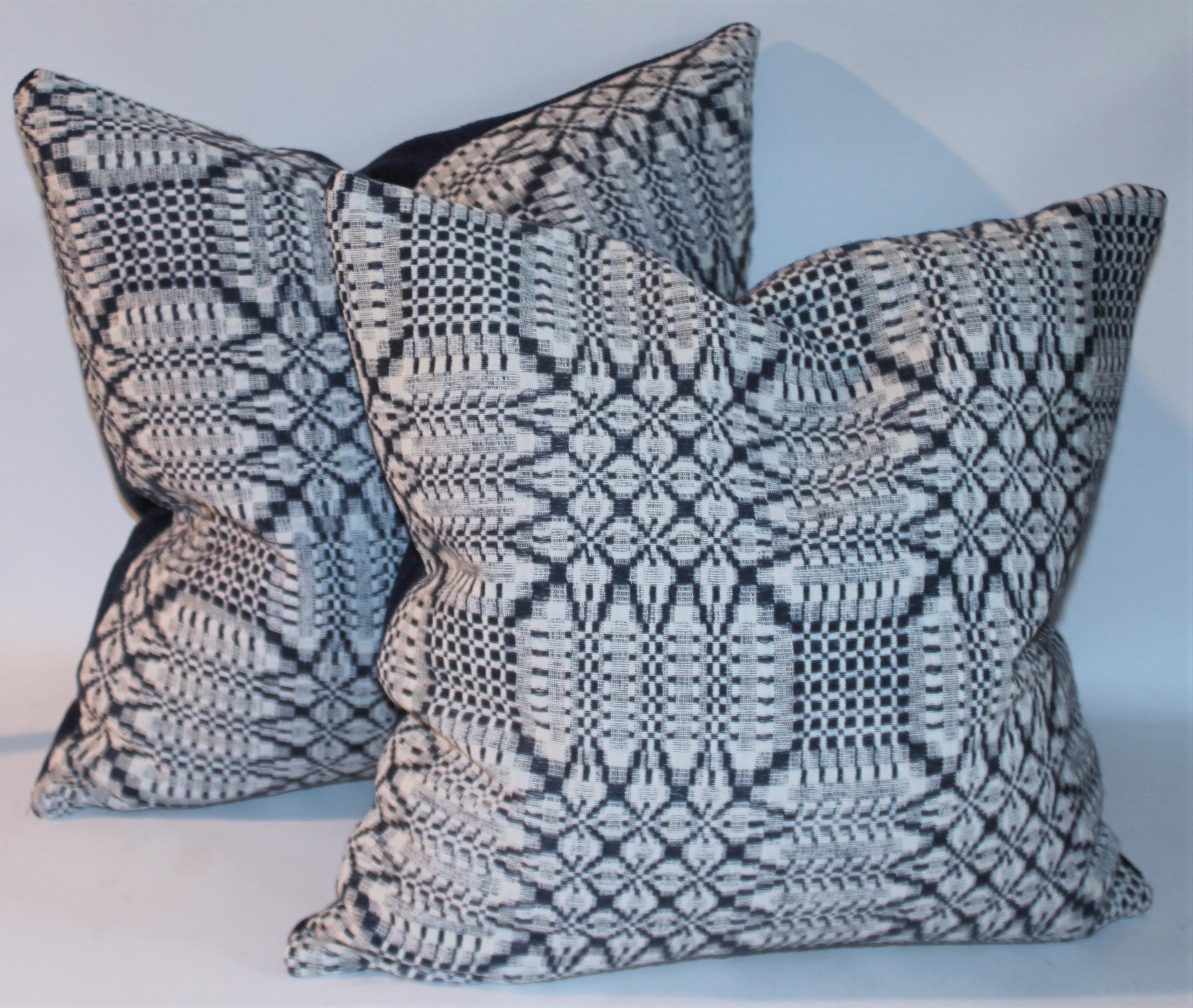 These hand woven 19thc coverlet pillows have a cream cotton linen backings. This collection of four , two pairs of 18 x 18 pillows have zippers for cleaning removal. The inserts are down & feather fill.