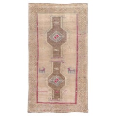 Light Brown and Beige Turkish Oushak Rug with Hot Pink Accents and Animal Motifs