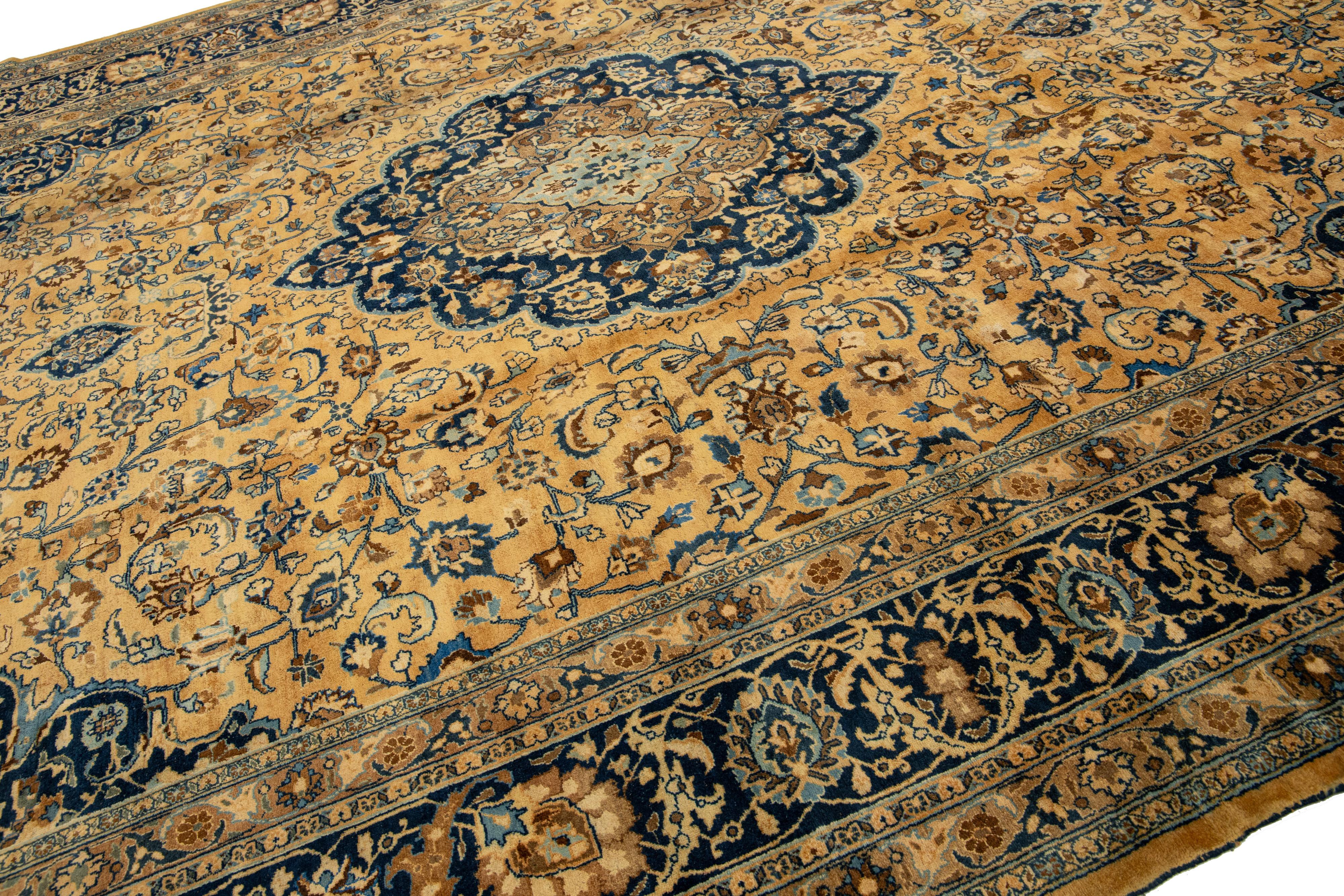 Islamic Light Brown Antique Persian Mashad Handmade Wool Rug With Rosette Motif For Sale