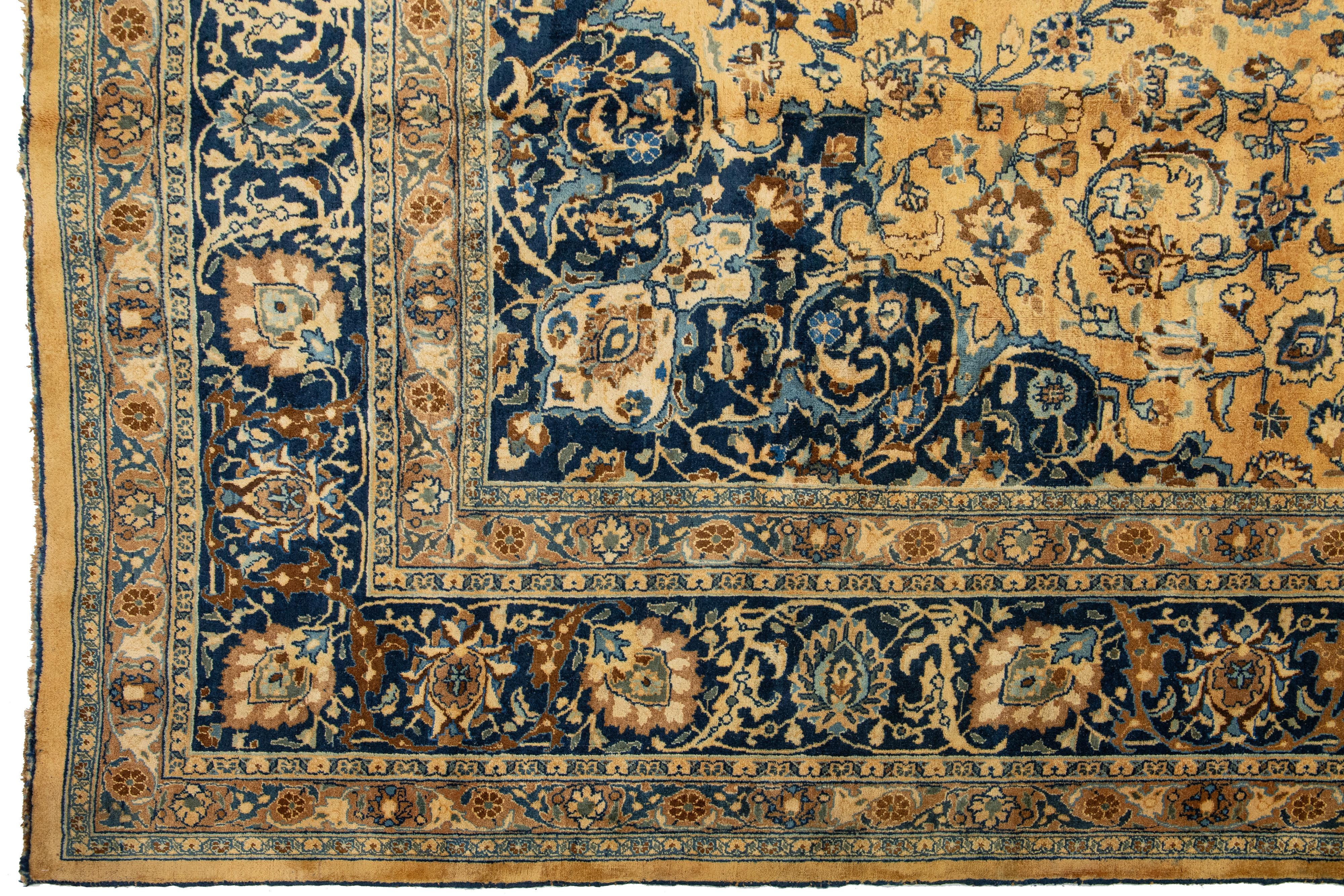 20th Century Light Brown Antique Persian Mashad Handmade Wool Rug With Rosette Motif For Sale